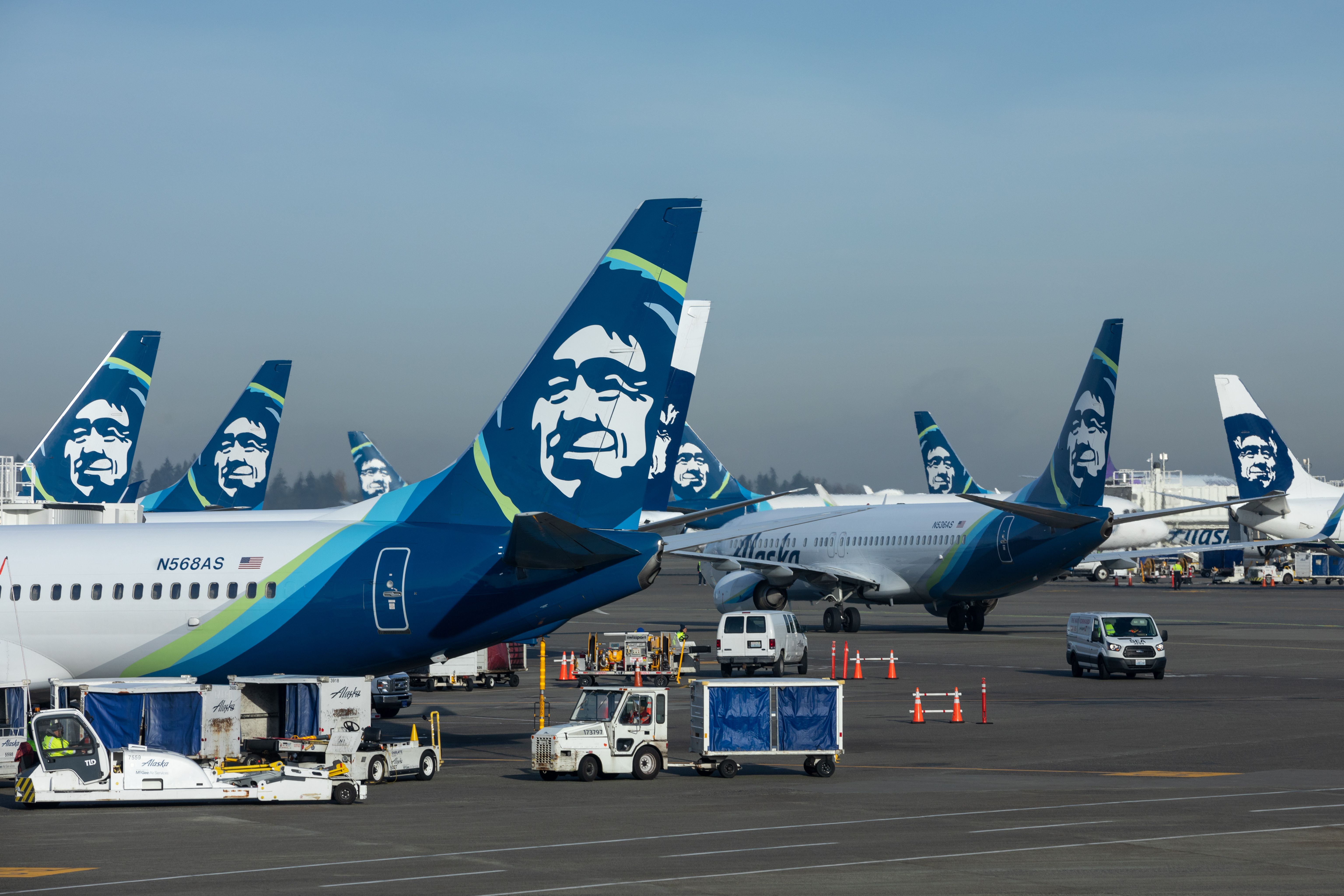 Several Alaska Airlines aircraft on the apron at Seattle Tacoma International Airport.