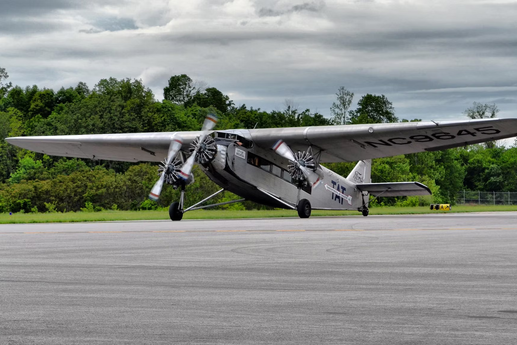 A Ford Trimotor on an airport apron.