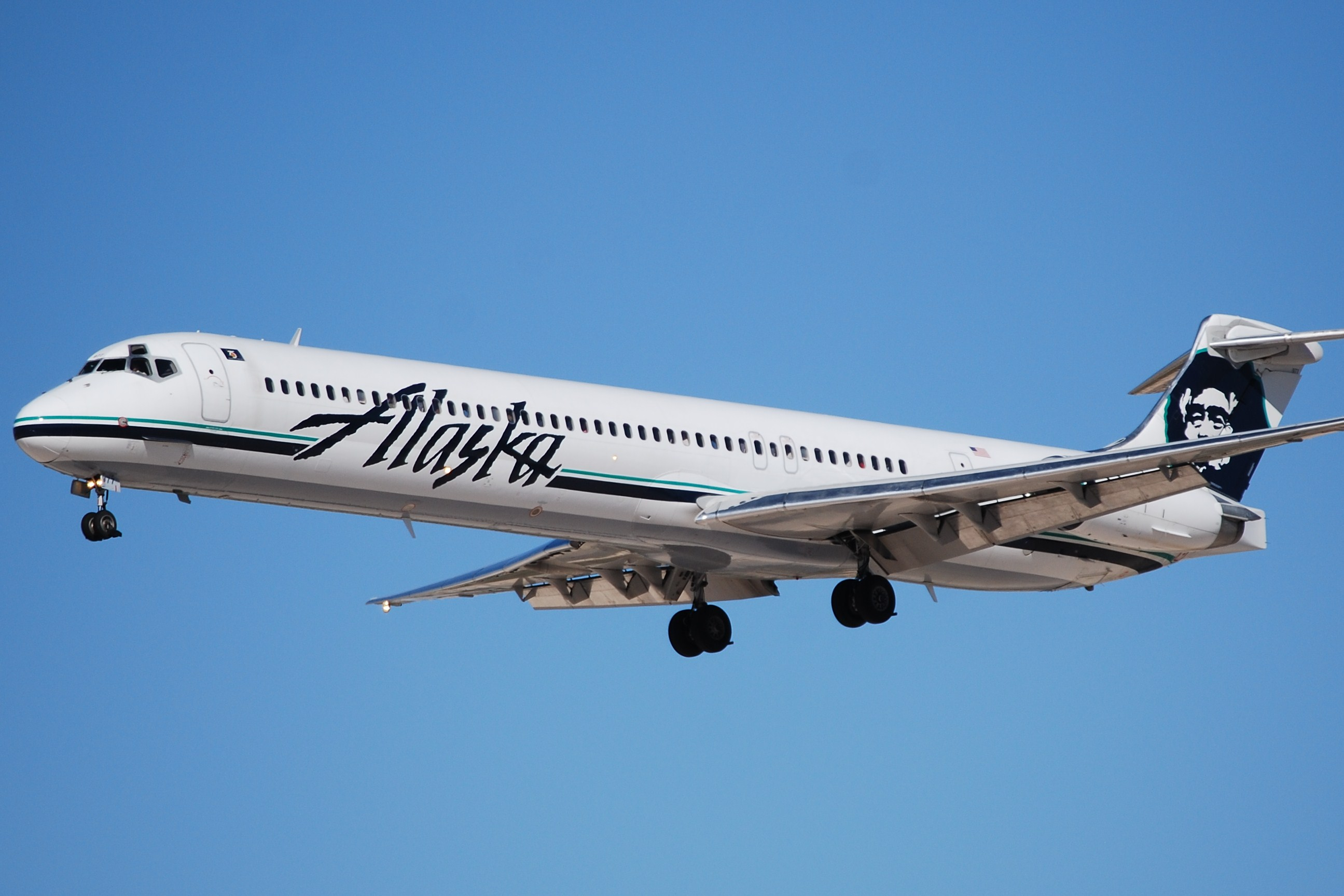 An Alaska Airlines MD-83 flying in the sky.