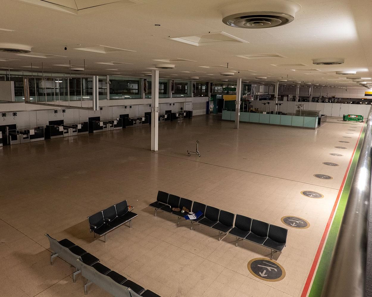 The empty passenger check-in area of LHR Terminal.