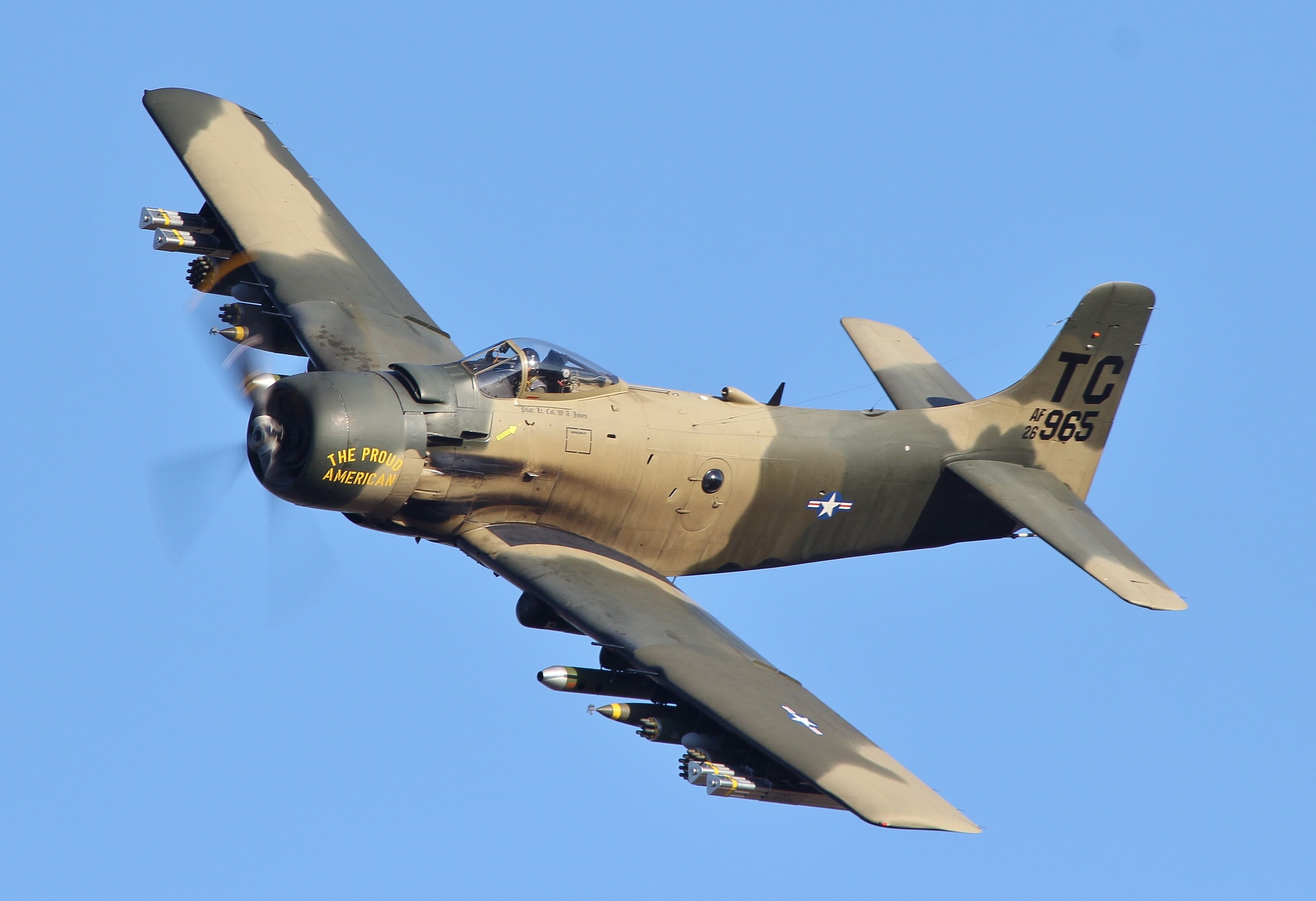 A Douglas A-1 Skyraider flying in the sky.