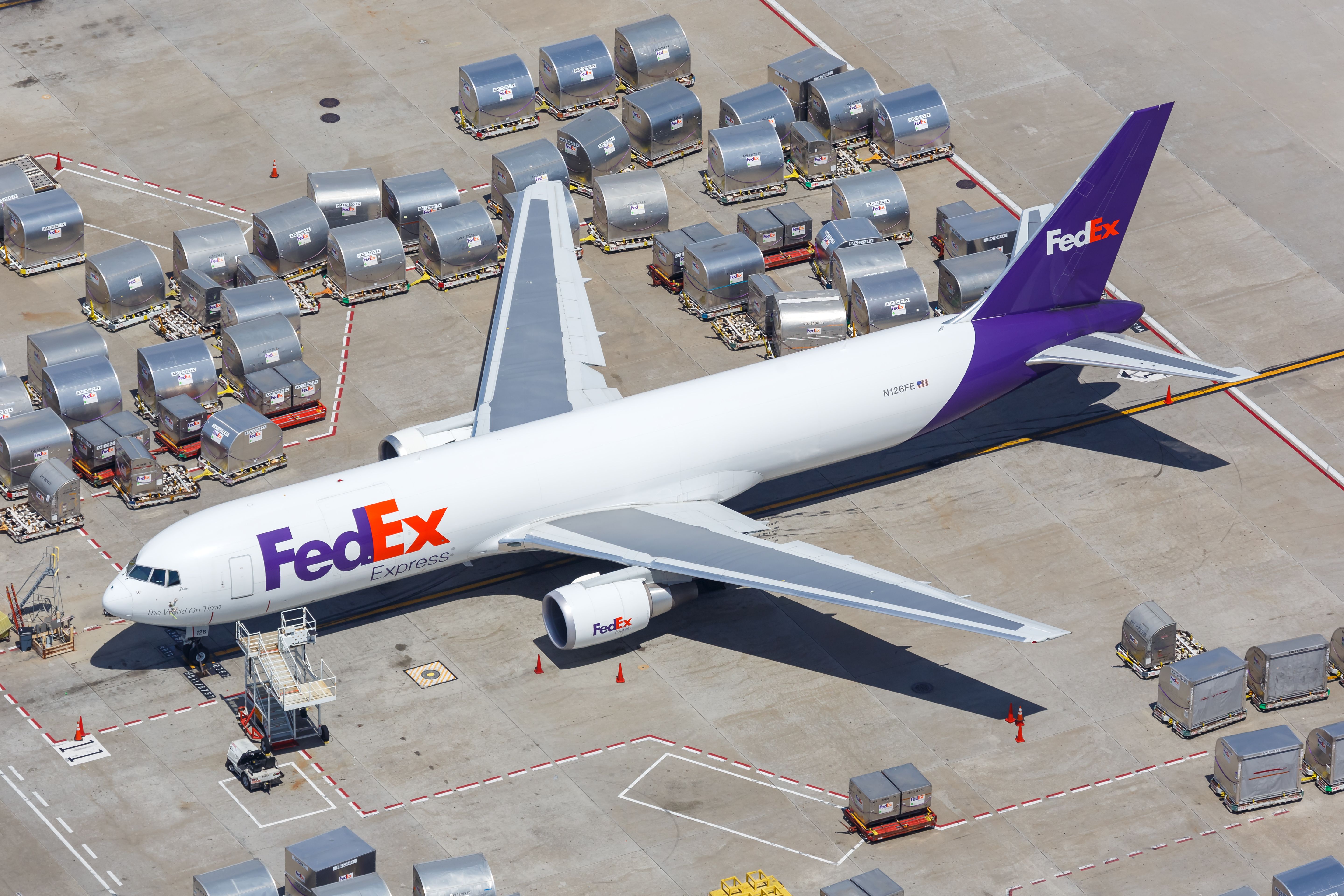 A FedEx Boeing 767F being loaded on the apron at Los Angeles International Airport.