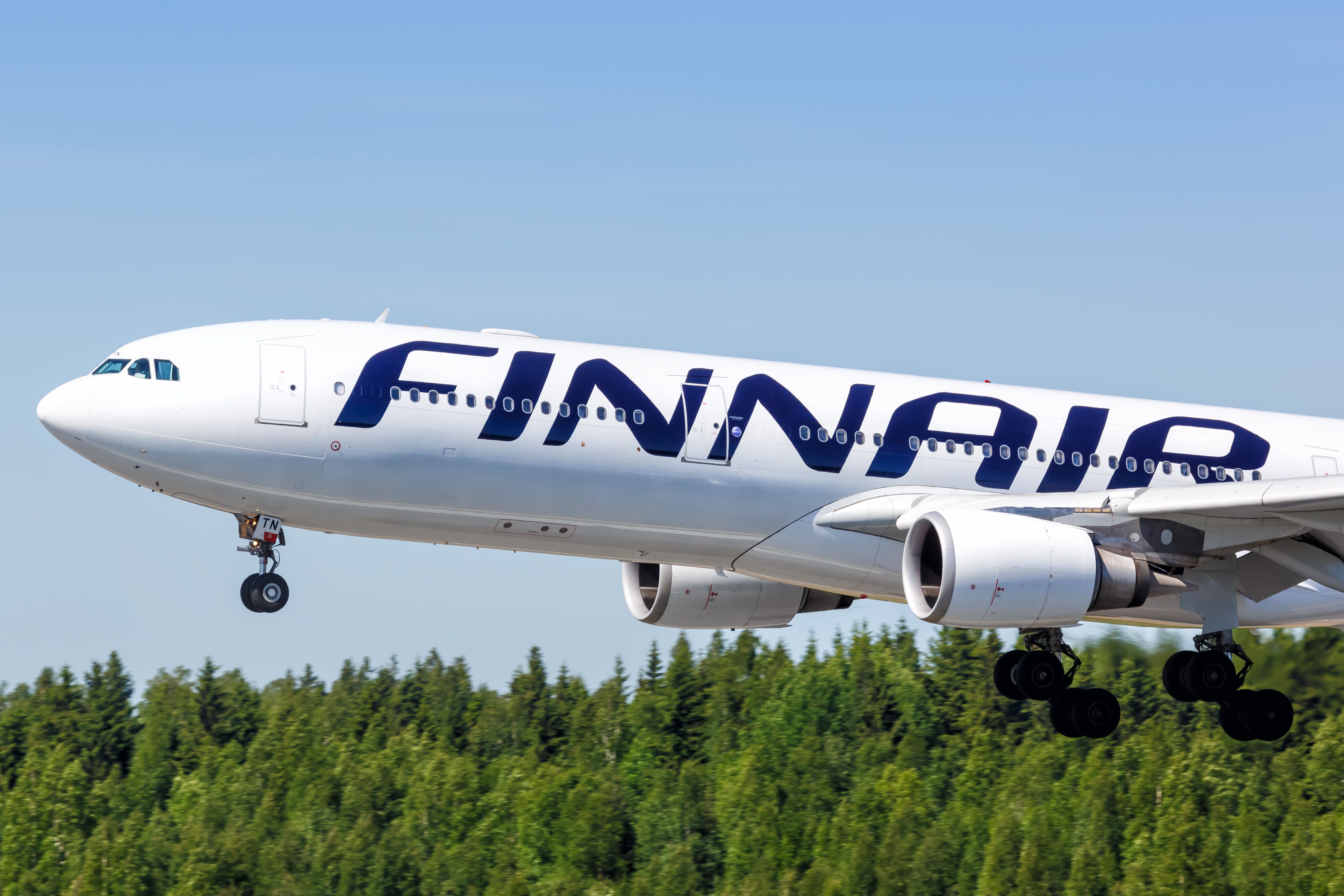 Finnair Airbus A330 landing at Helsinki Airport HEL shutterstock_1612017130