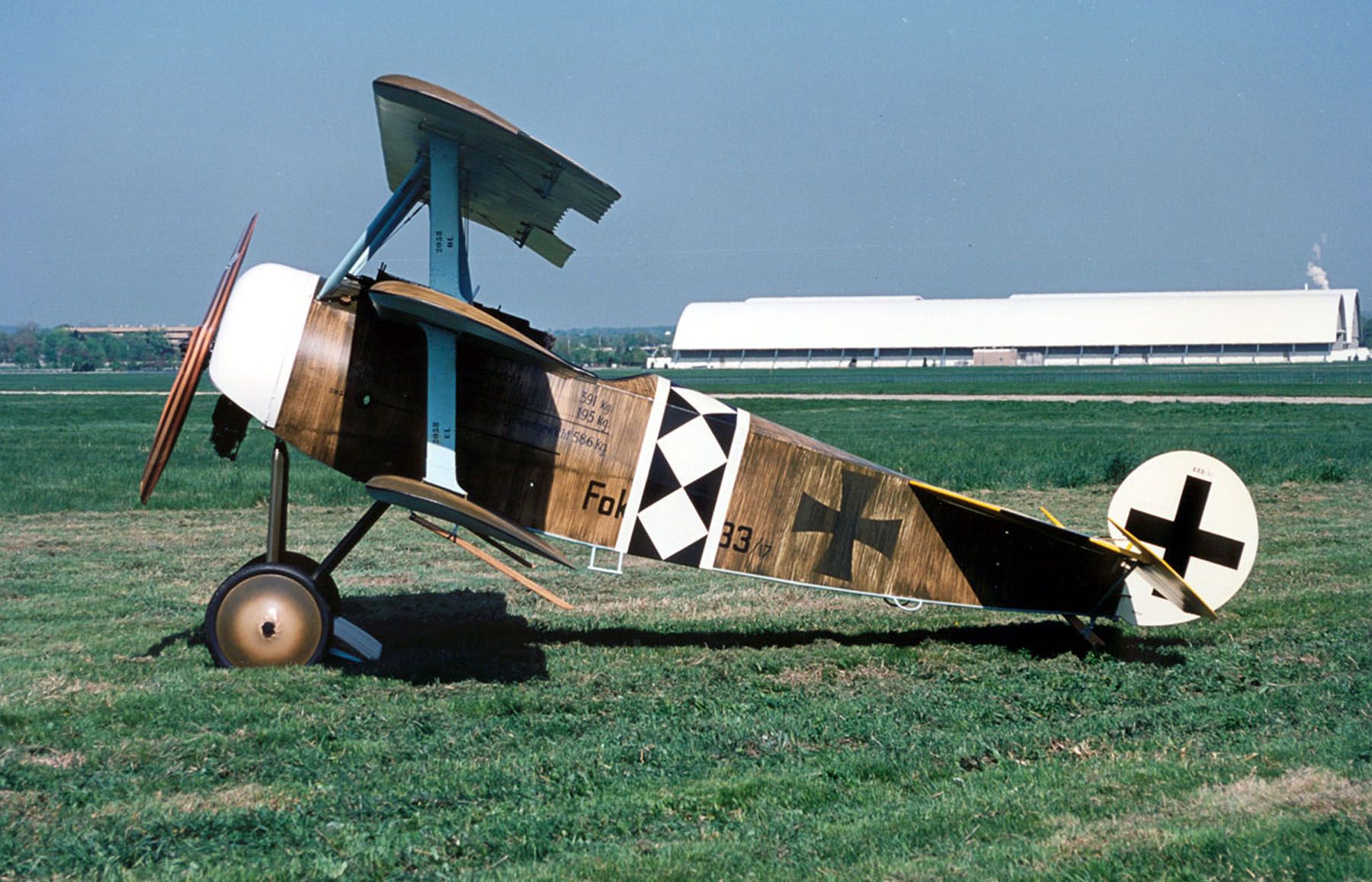 A Fokker Dr.I sitting in a field.