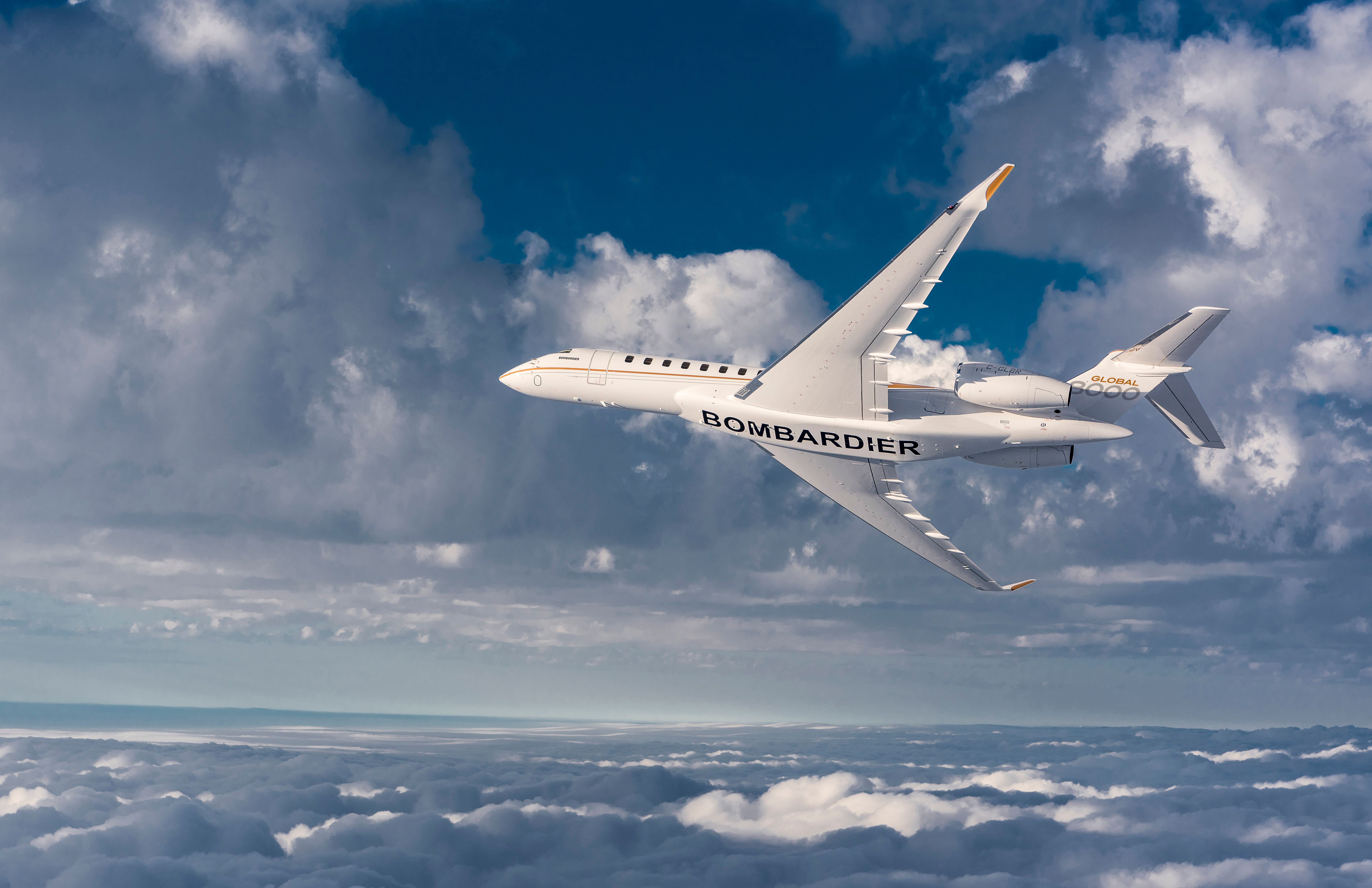 A Bombardier Global 8000 Flying above the clouds.