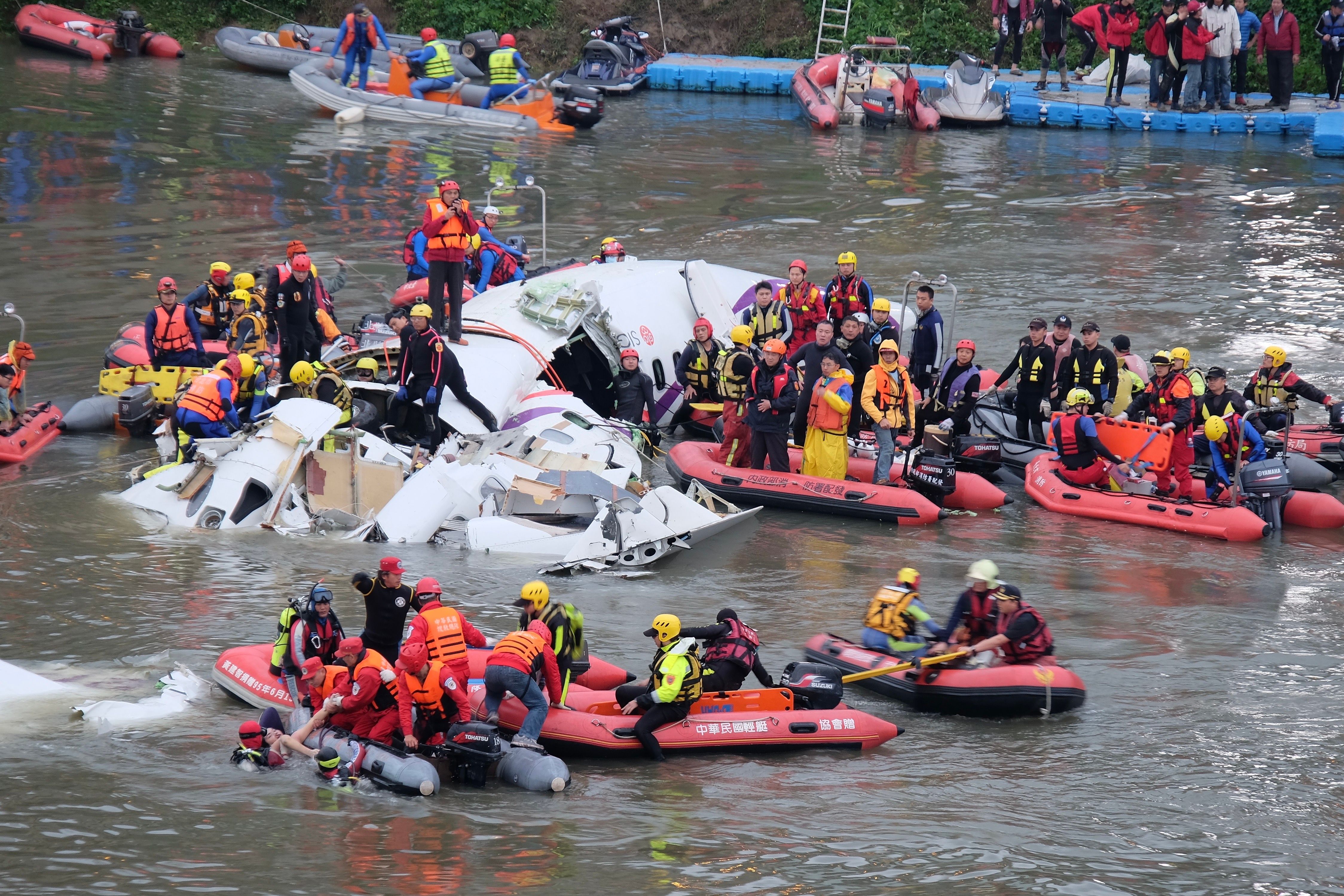 Survivors being rescued from a river after TransAsia Airways Flight 235 crashed.