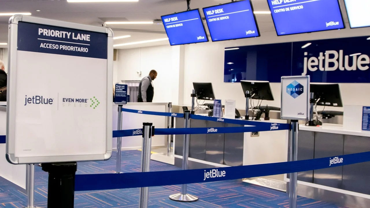 A JetBlue Priority lane near an airport security area.