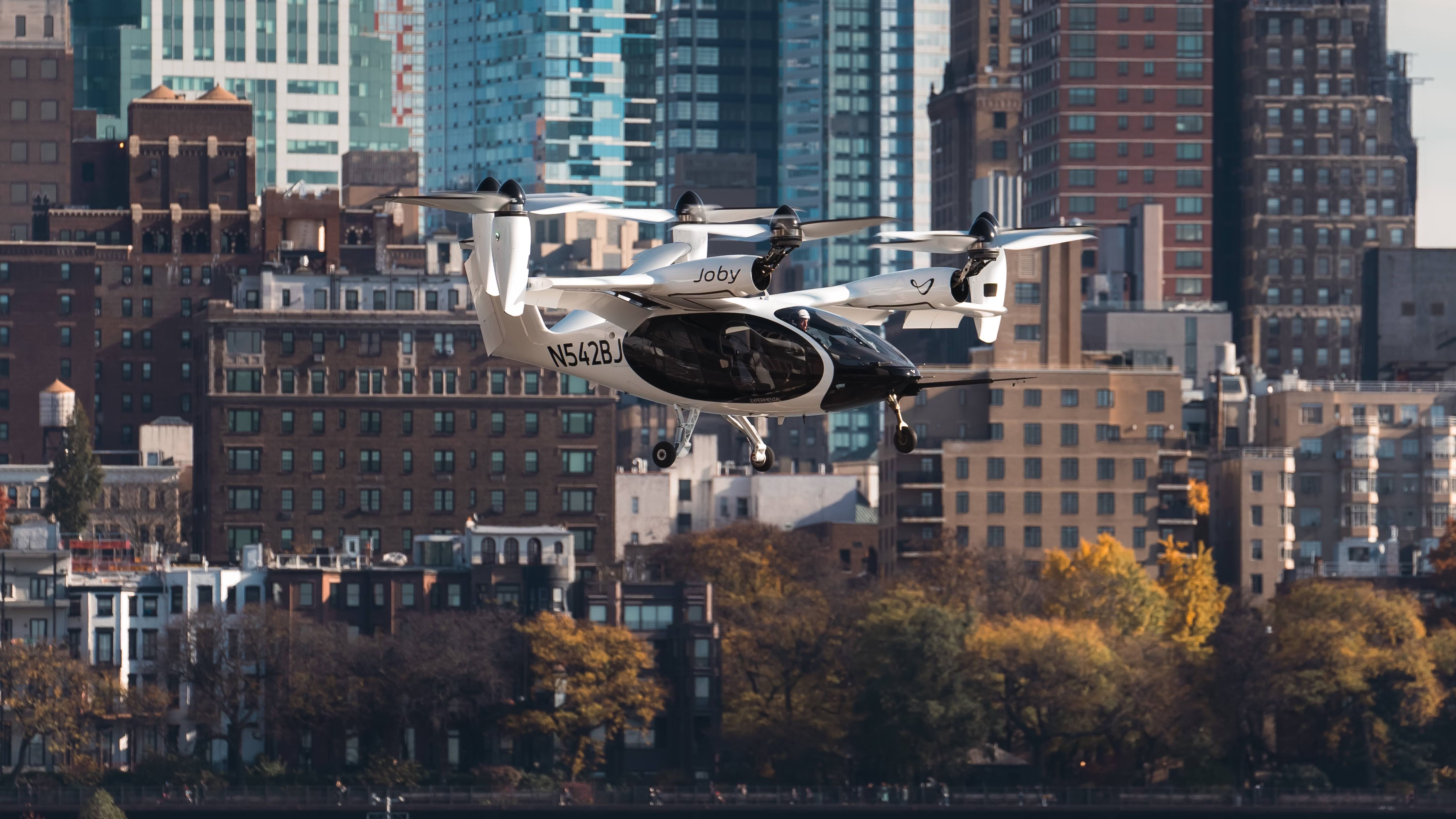 An eVTOL aircraft hovering in the sky.