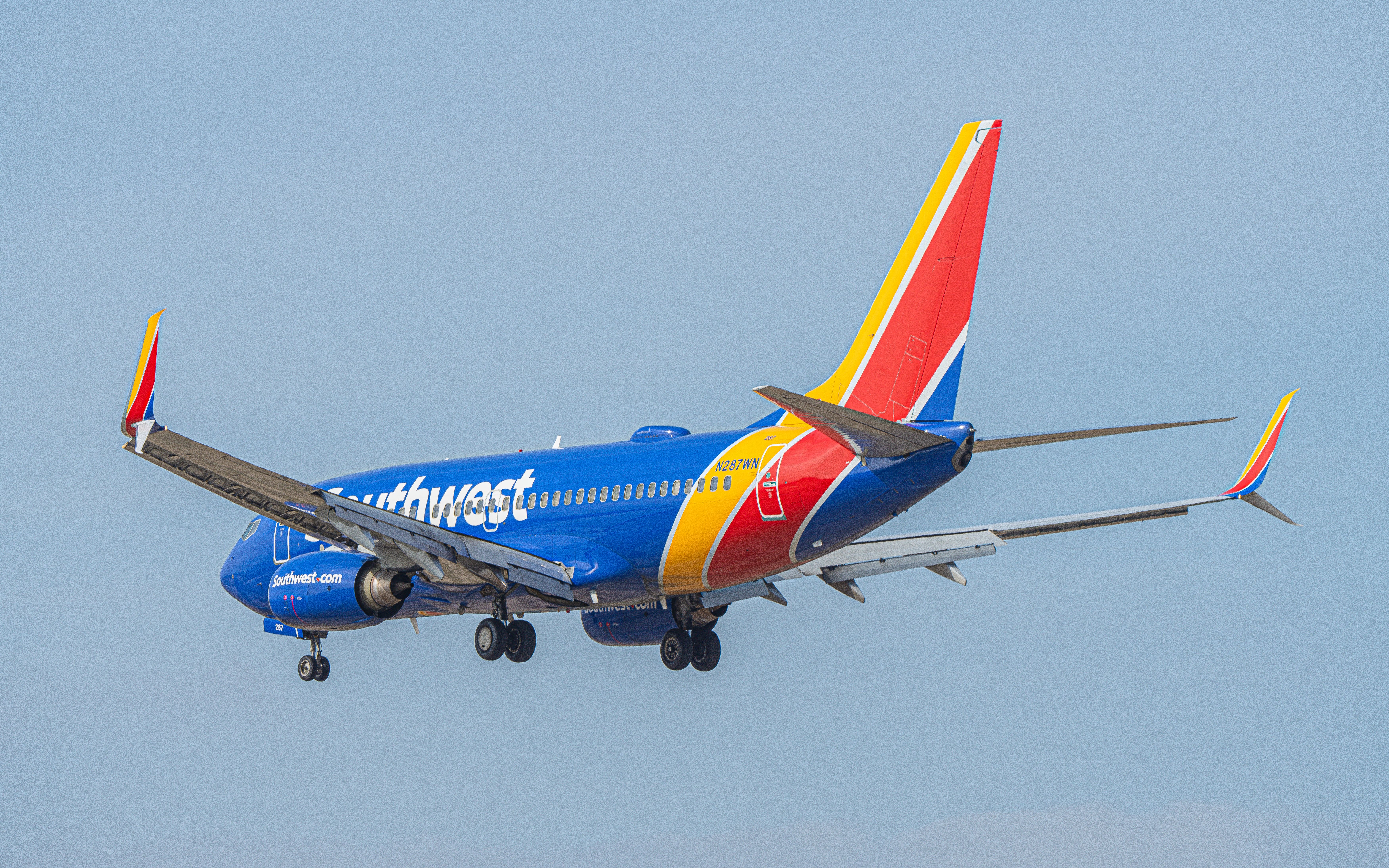 A Southwest Airlines Boeing 737-700 Flying in the sky.