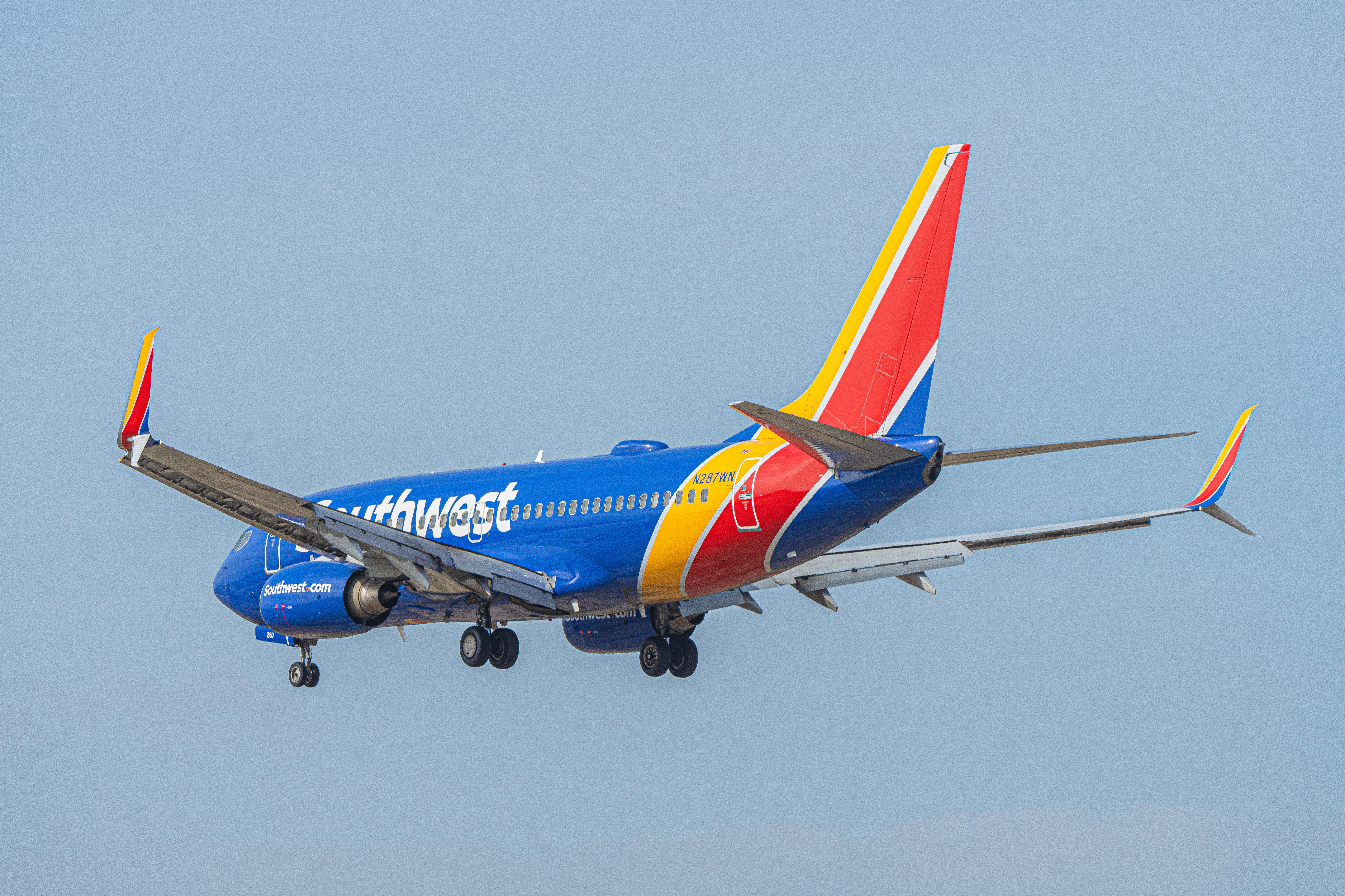 A Southwest Airlines Boeing 737-700 flying in the sky.