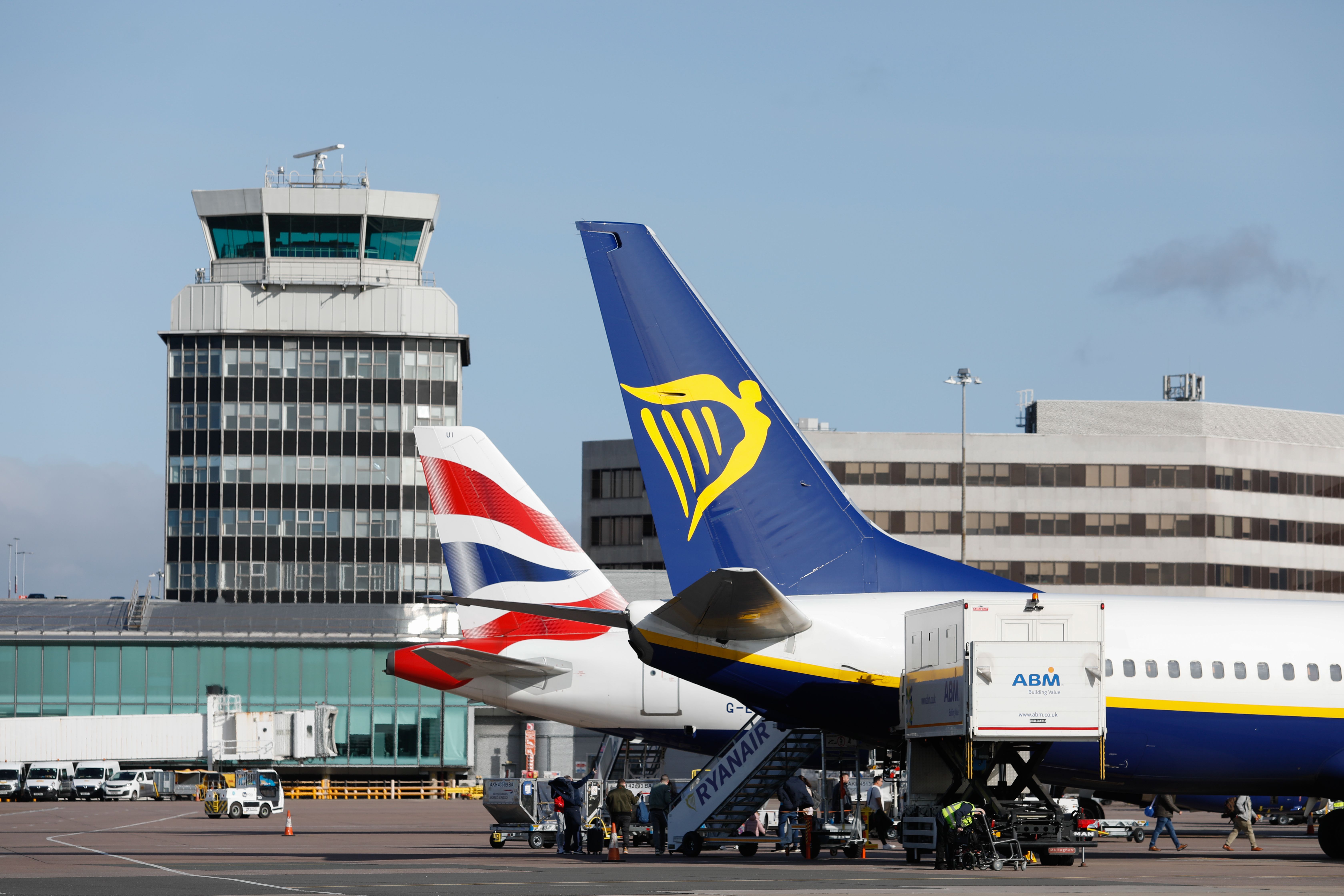 British Airways & Ryanair Aircraft parked on the apron At Manchester Airport.