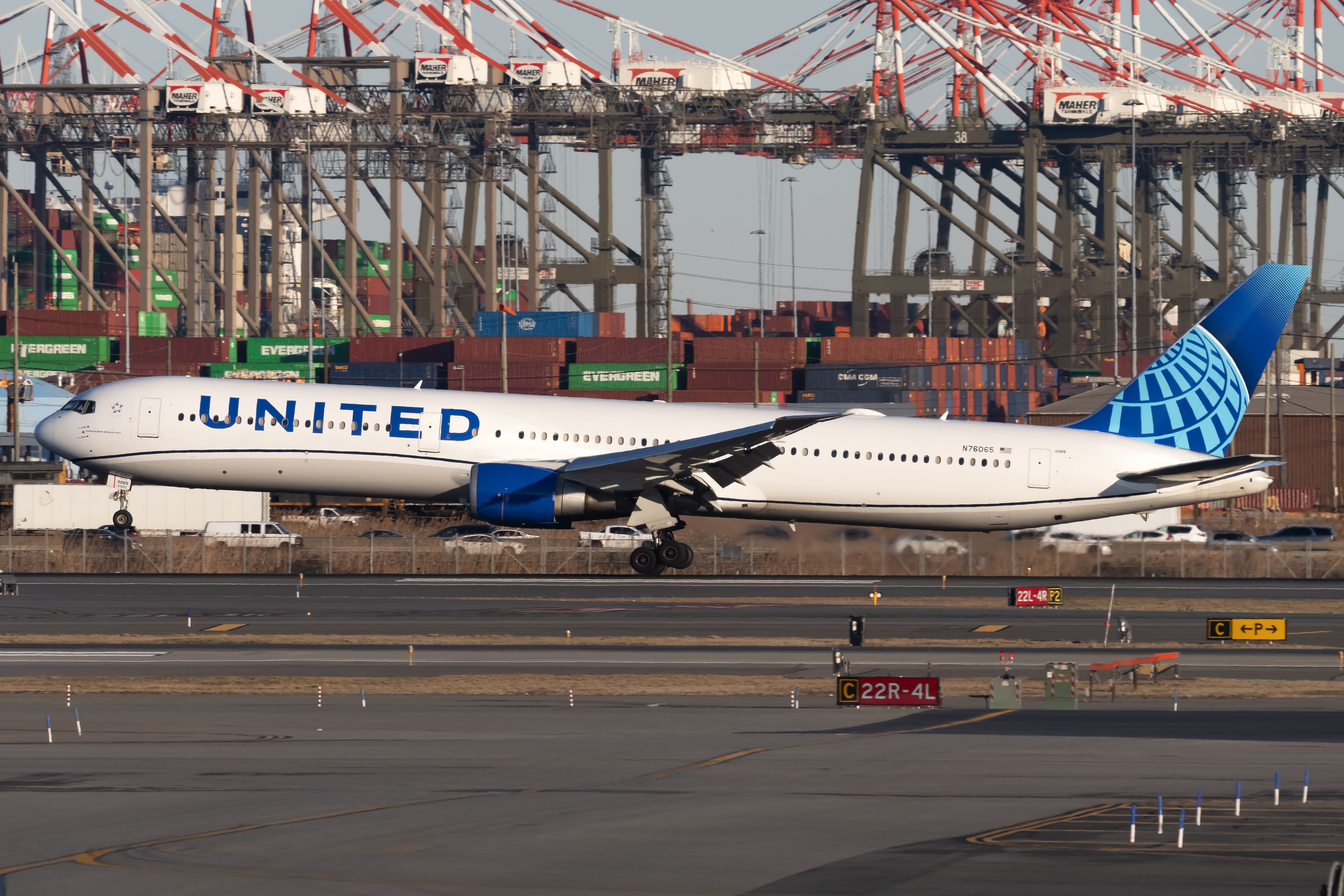 A United Airlines Boeing 767-400ER Landing on a runway at Newark Airport.