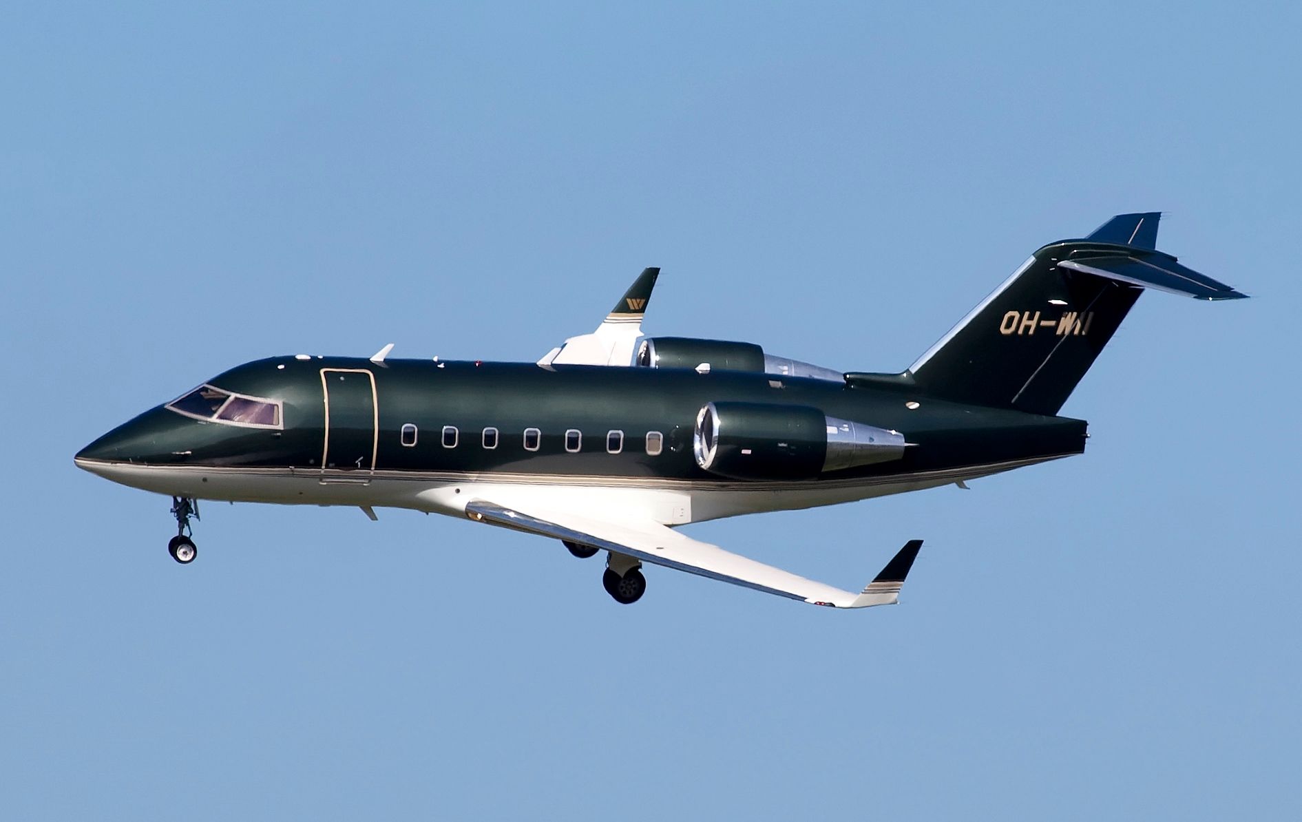 A Bombardier Challenger 604 Flying in the sky.