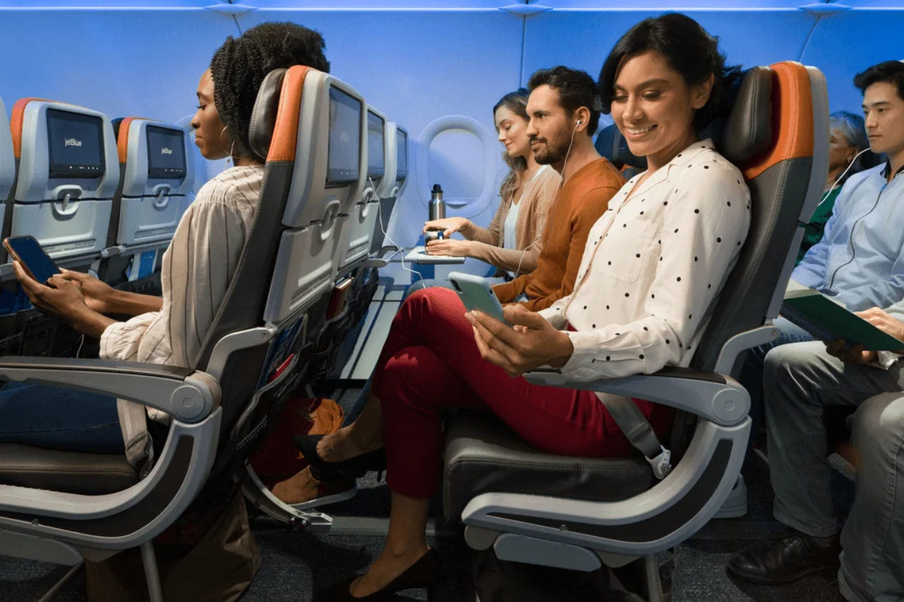 Passengers sitting in JetBlue's EvenMoreSpace cabin.