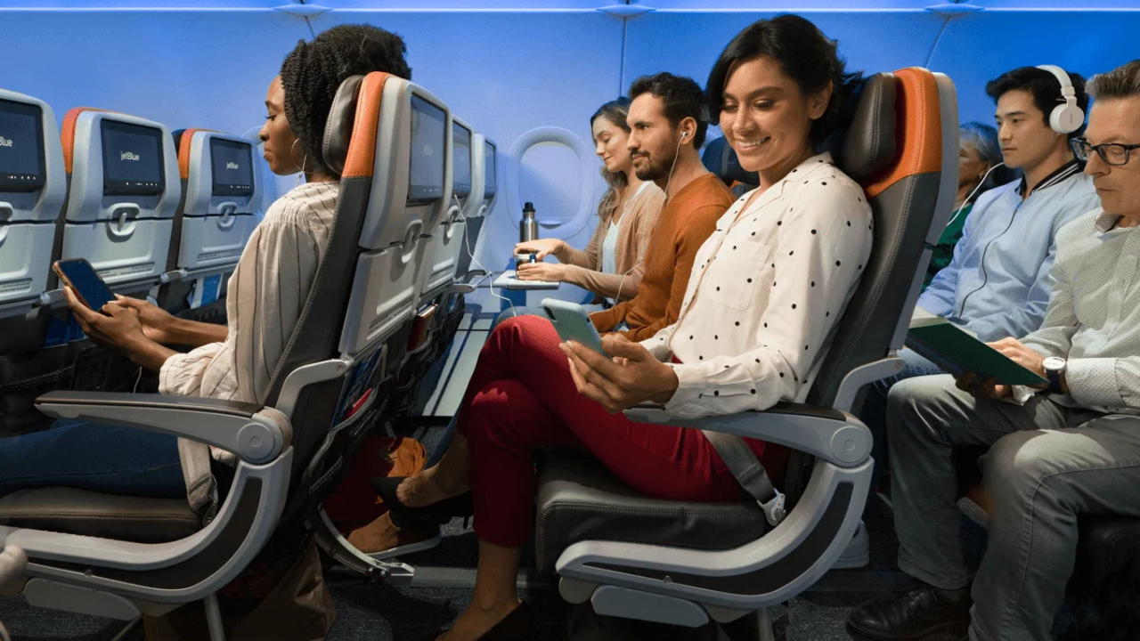 Passengers sitting in JetBlue's EvenMoreSpace cabin.