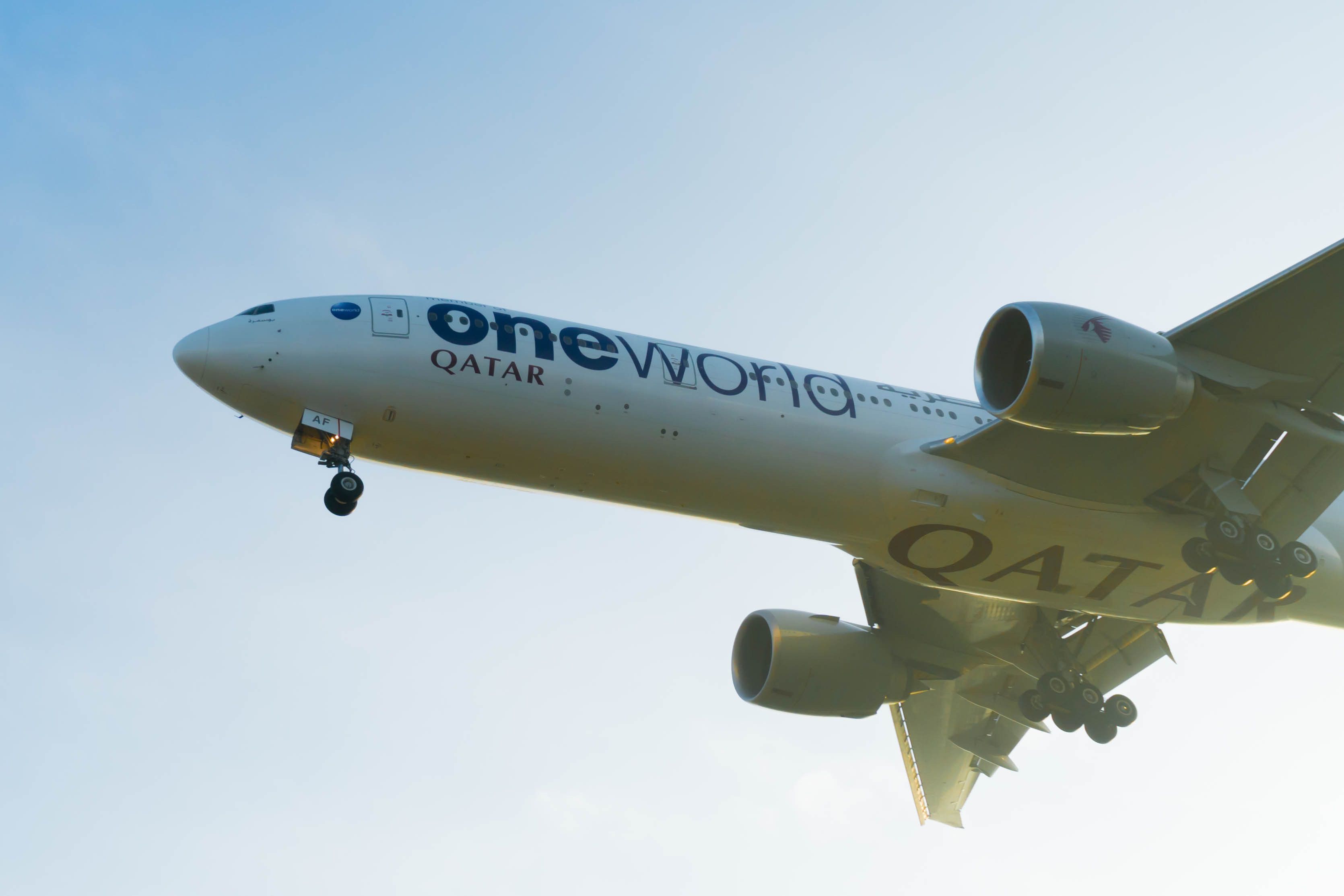 Qatar Airways oneworld Boeing 777 landing at Kuala Lumpur International Airport KUL shutterstock_546290551
