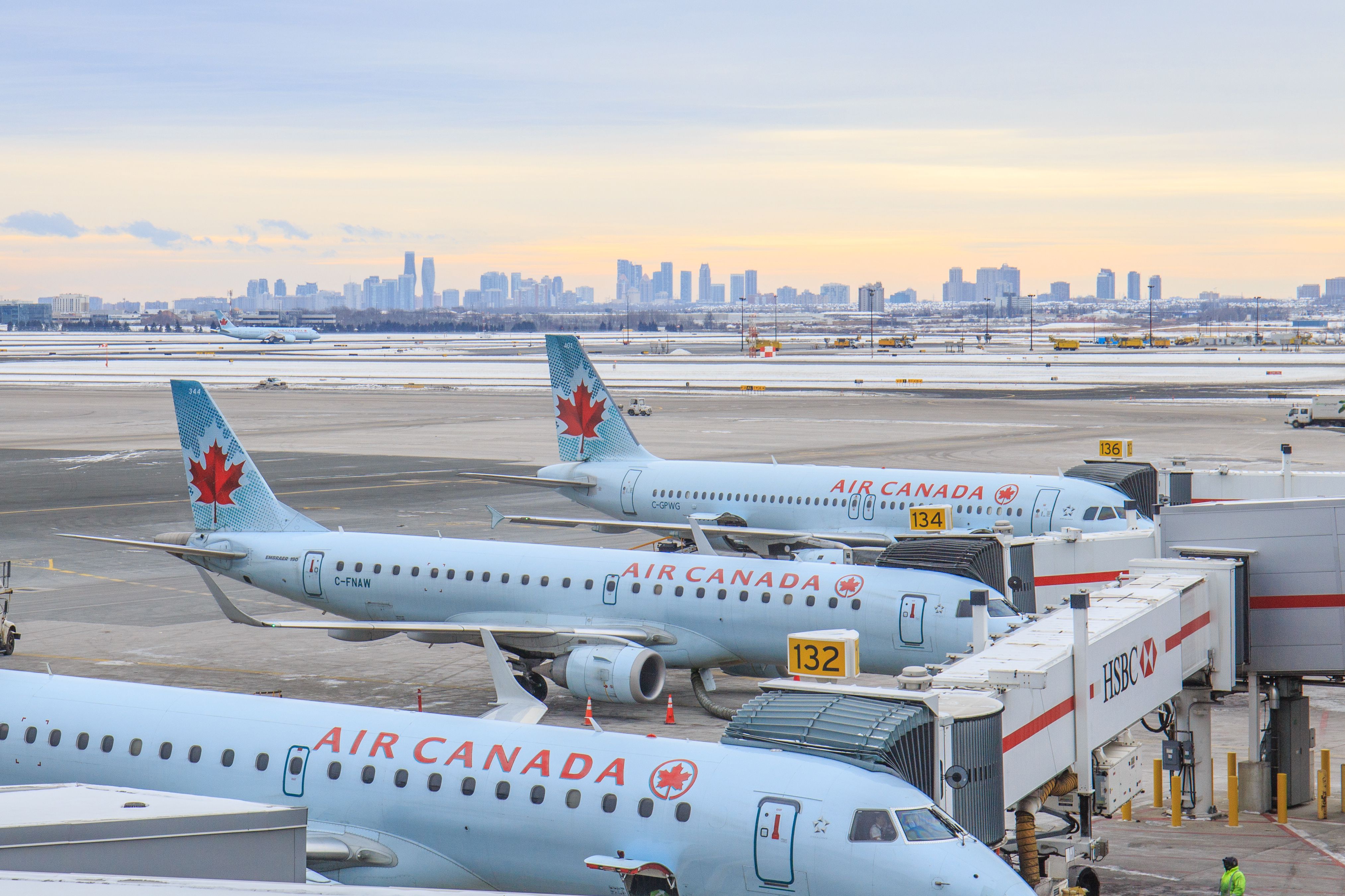 Multiple Air Canada E190 aircraft parked on the apron in Toronto.