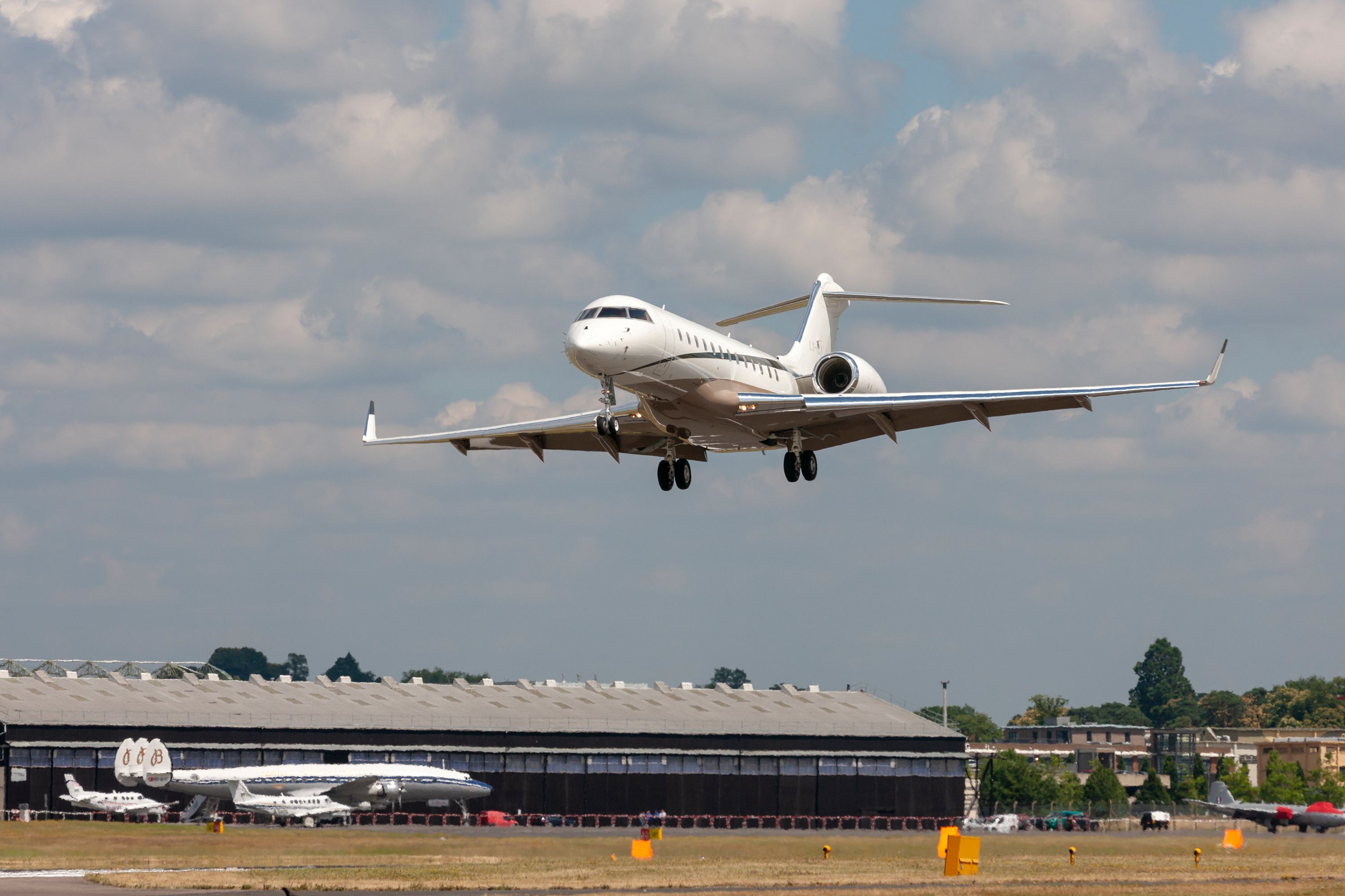 A Bombardier Global Express XRS flying low to the ground.