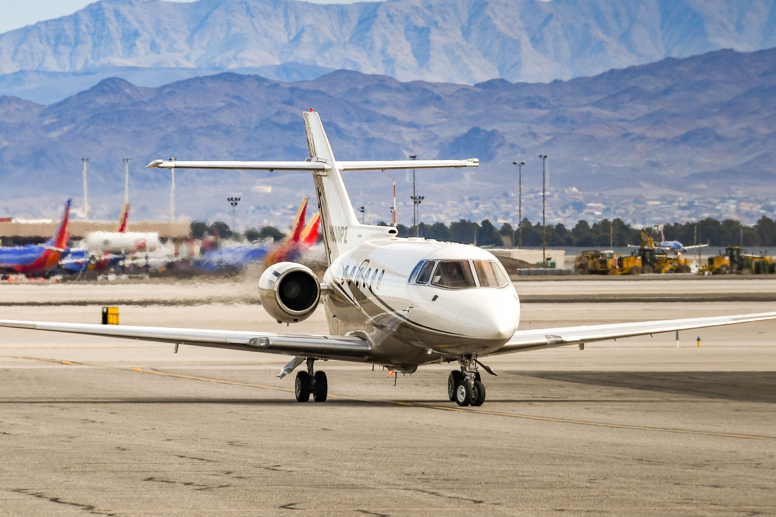Hawker 800 private executive jet taxiing after landing at Harry Reid International Airport in Las Vegas.
