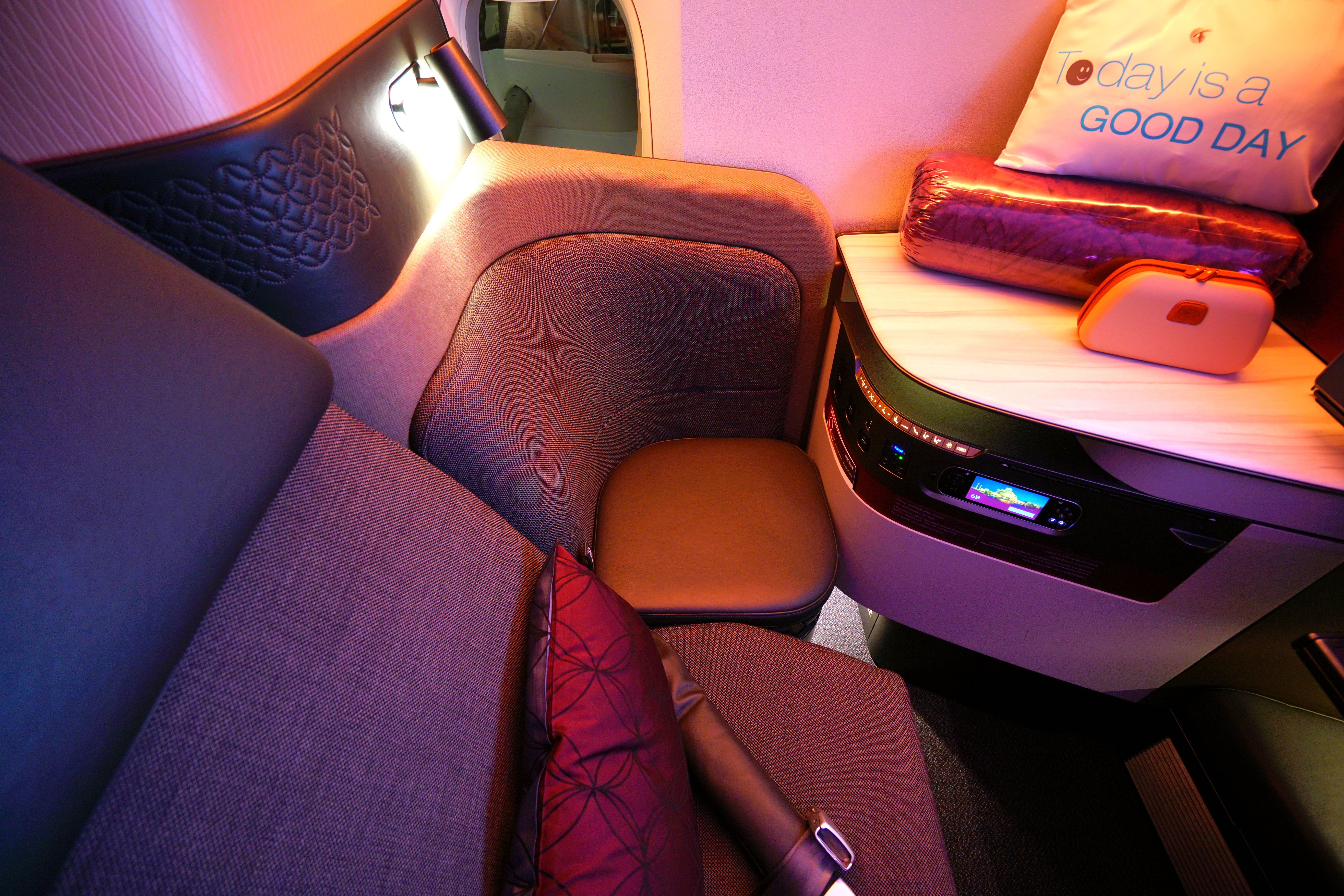 Inside a Qatar Airways QSuite seat.