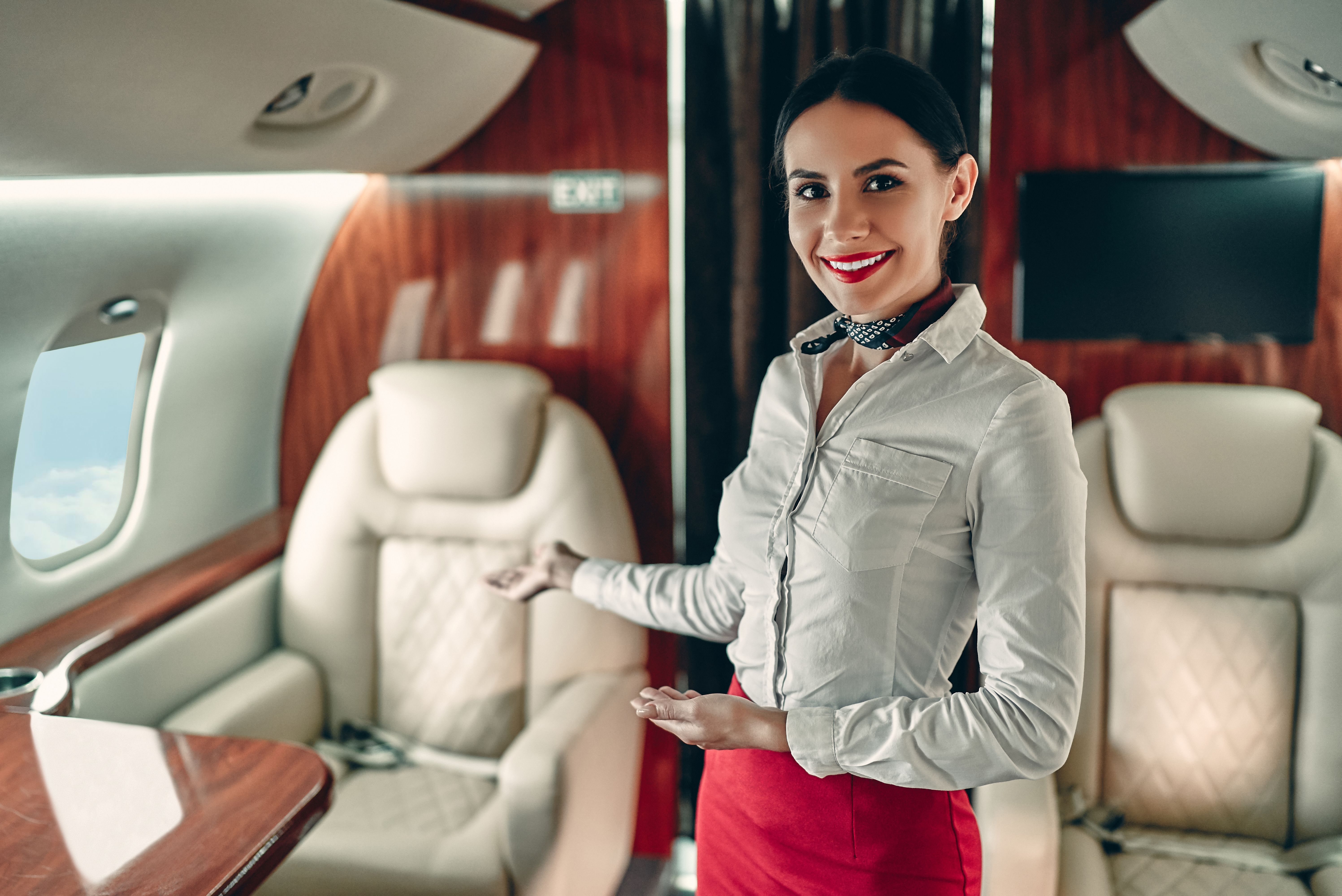 A Cabin Attendant Onboard A Private Jet.