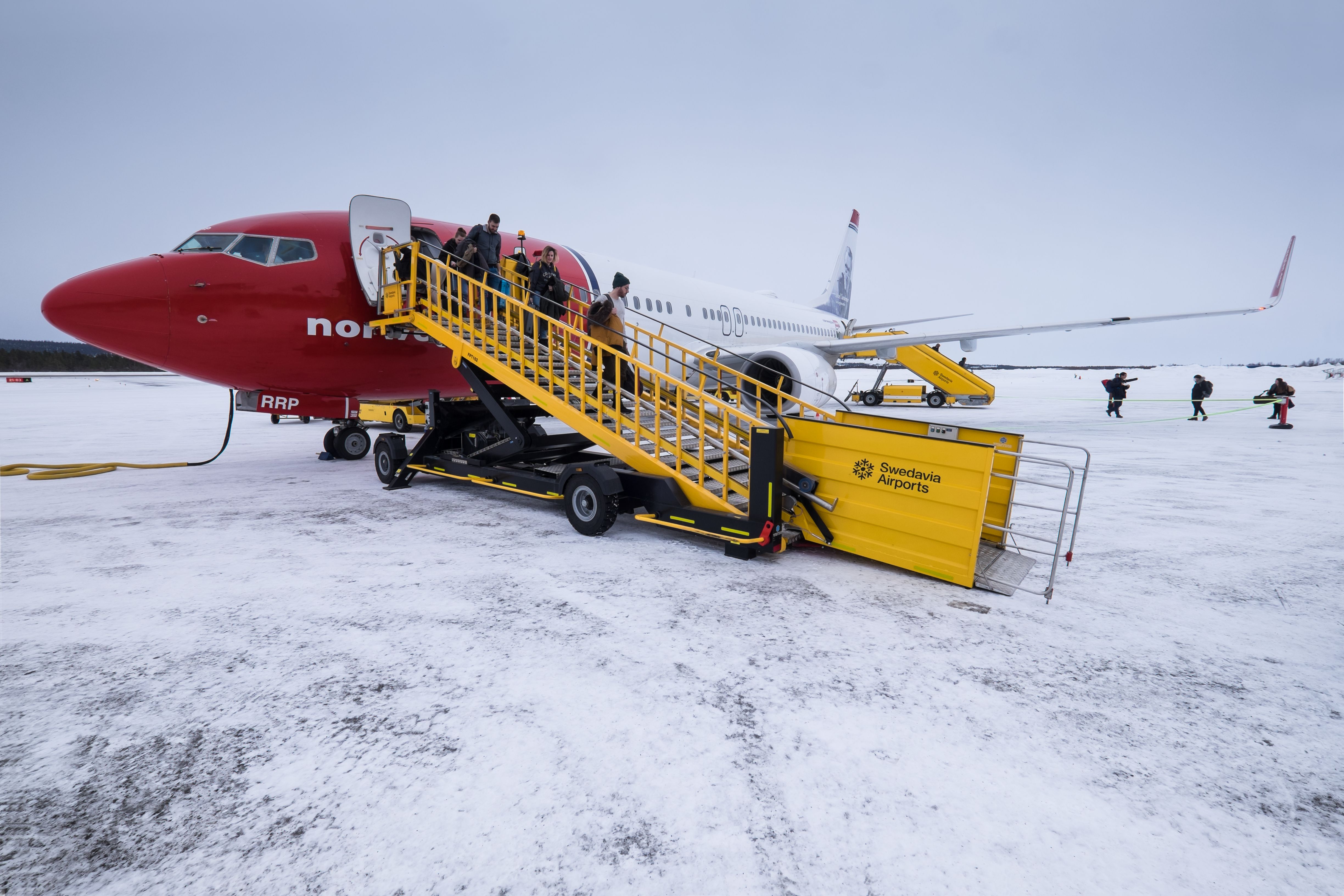 A Norwegian Boeing 737 Parked on the apron at Kiruna Airport In The Snow.