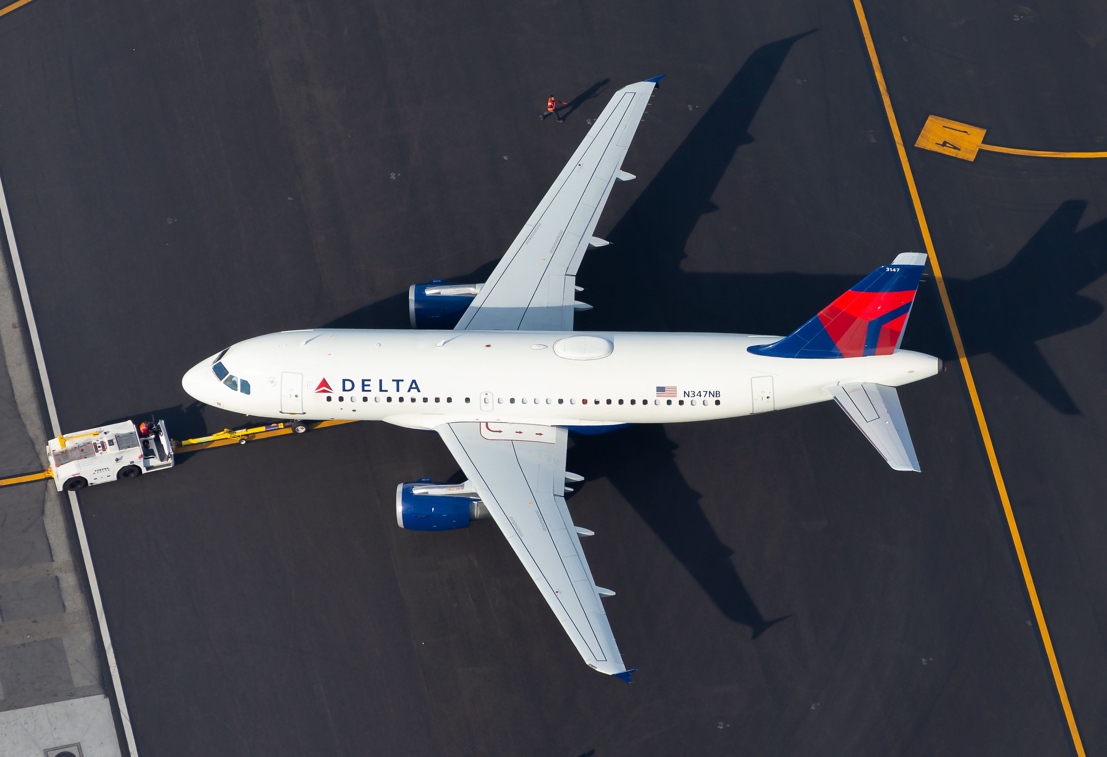 Delta Air Lines Airbus A319 pushing back at Los Angeles International Airport.