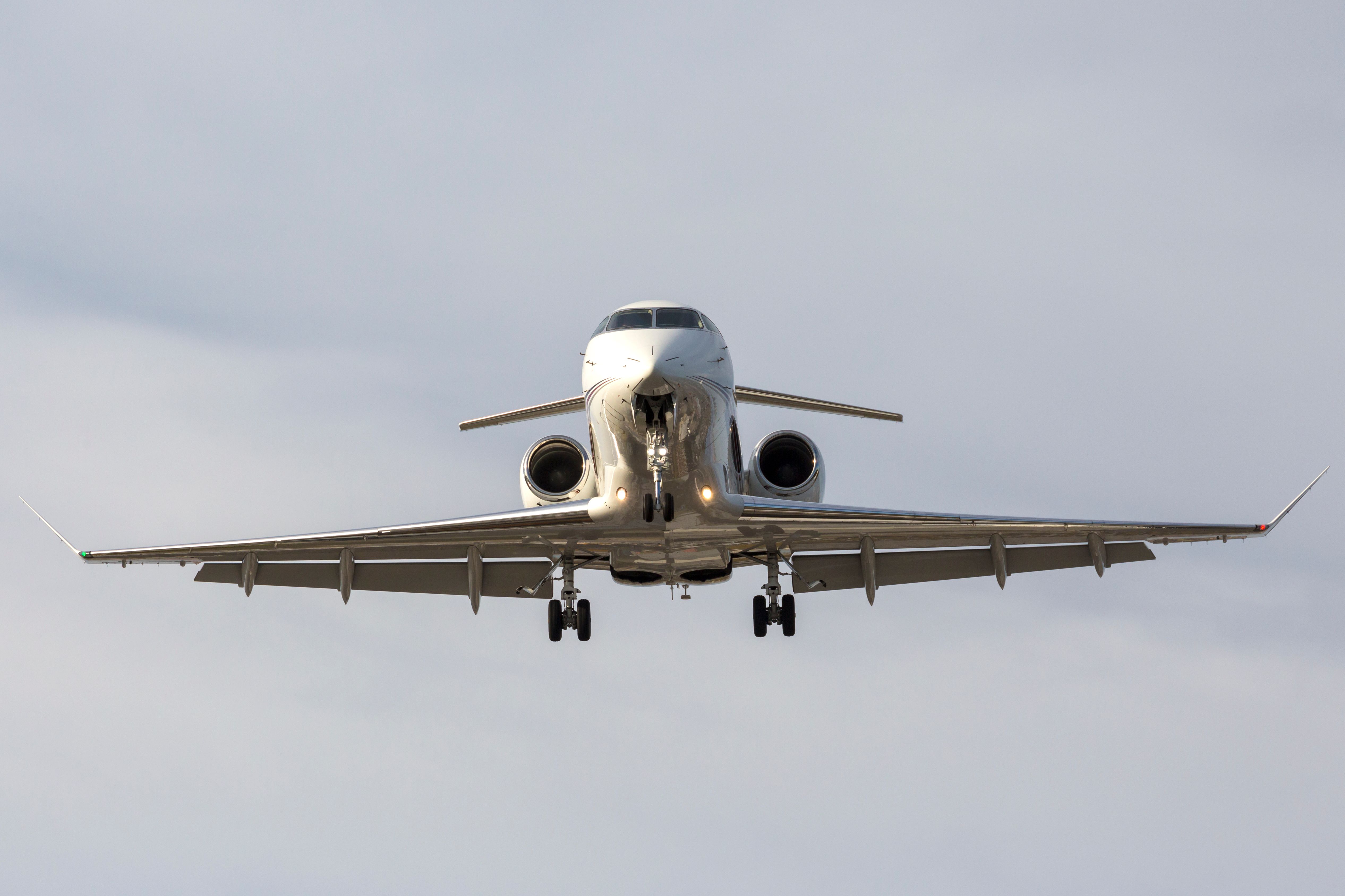 A Front Profile View of a Private Jet with its gear down.