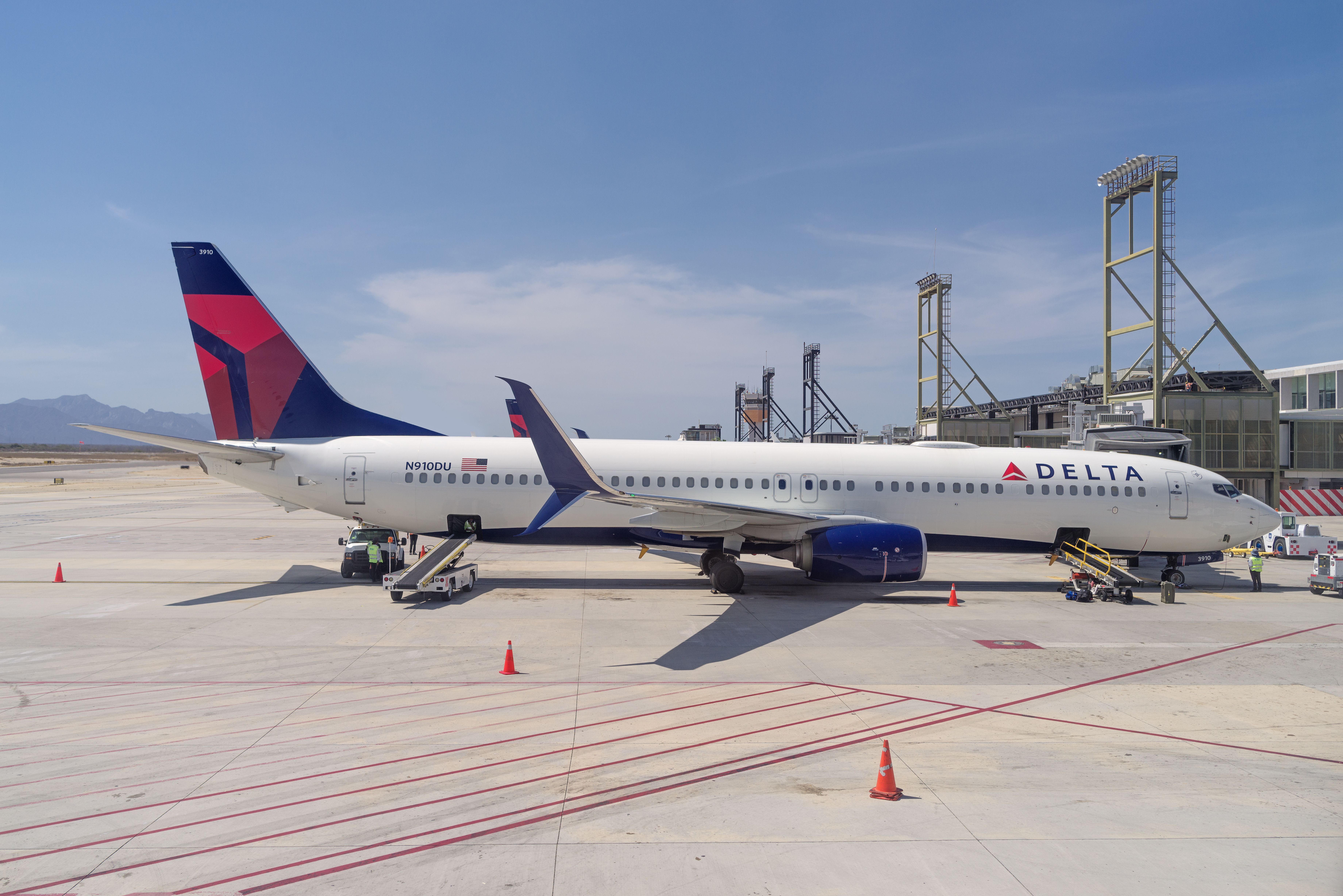 A Delta Air Lines Boeing 737-900ER parked at an airport