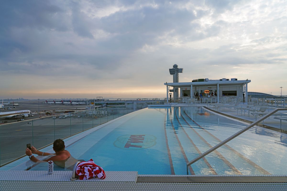 Someone in the swimming pool on the roof of the TWA Hotel at JFK Airport.