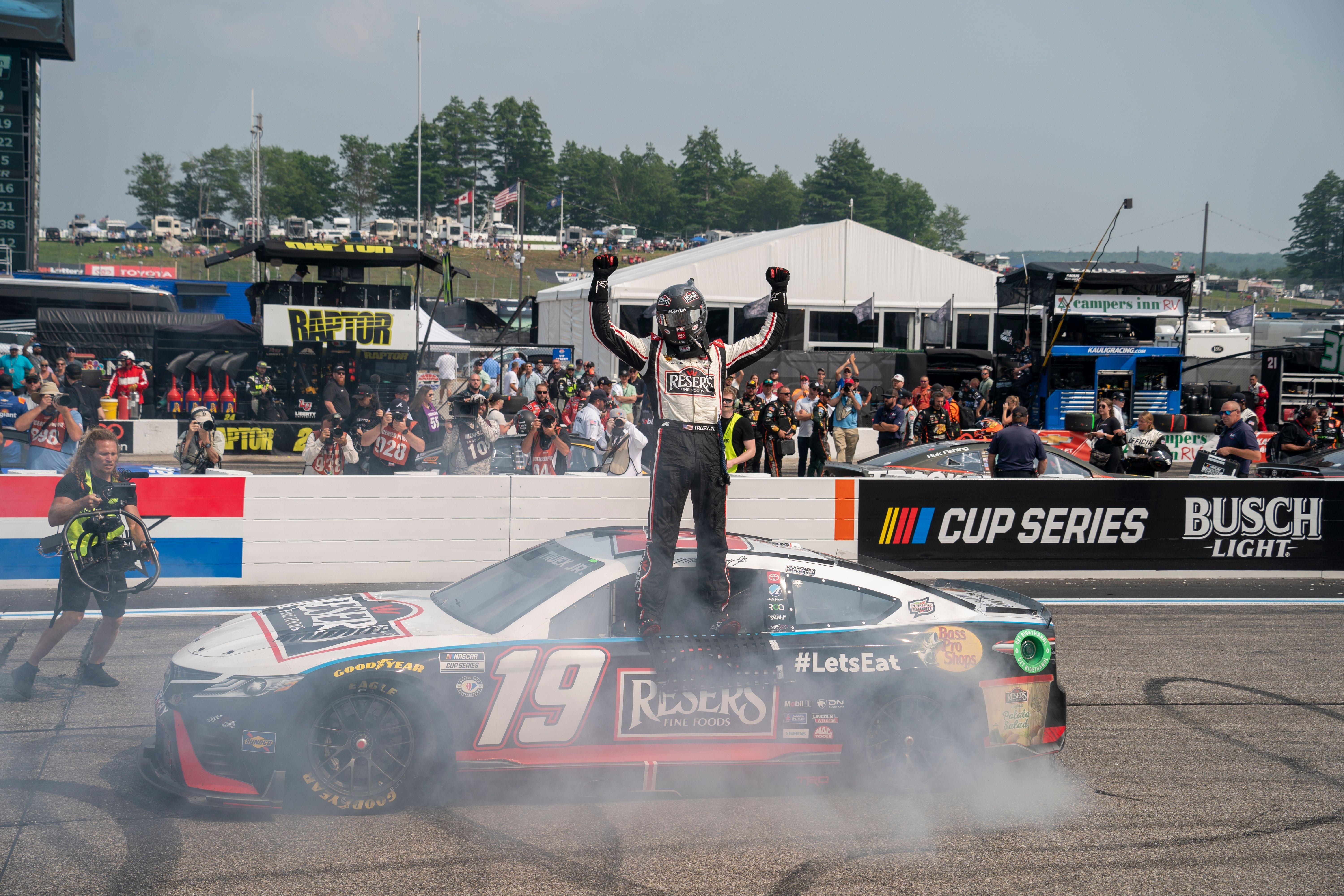 Martin Truex Jr Celebrating a NASCAR Cup Series Race Win.