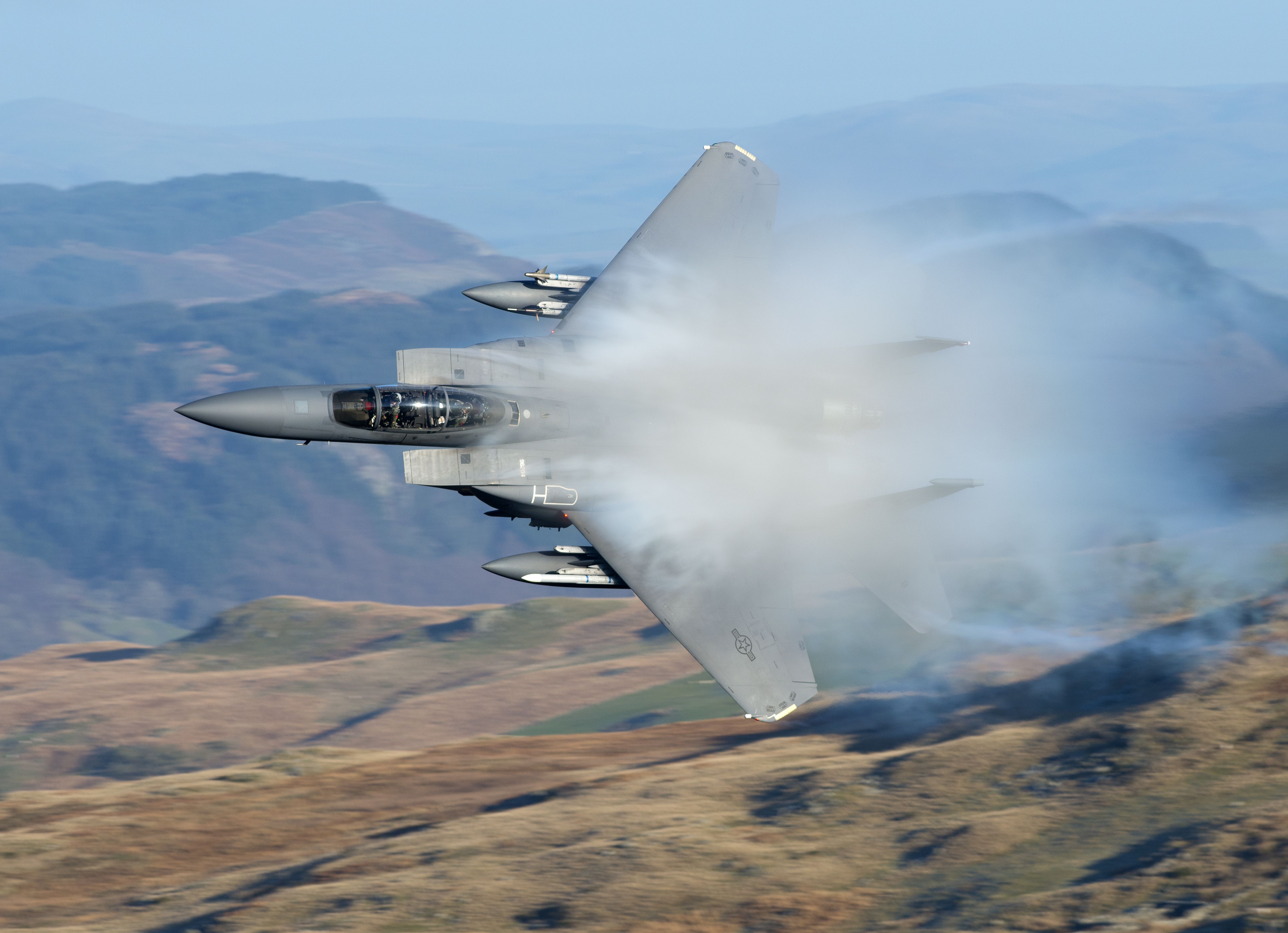 An F-15E Strike Eagle flying in the sky.