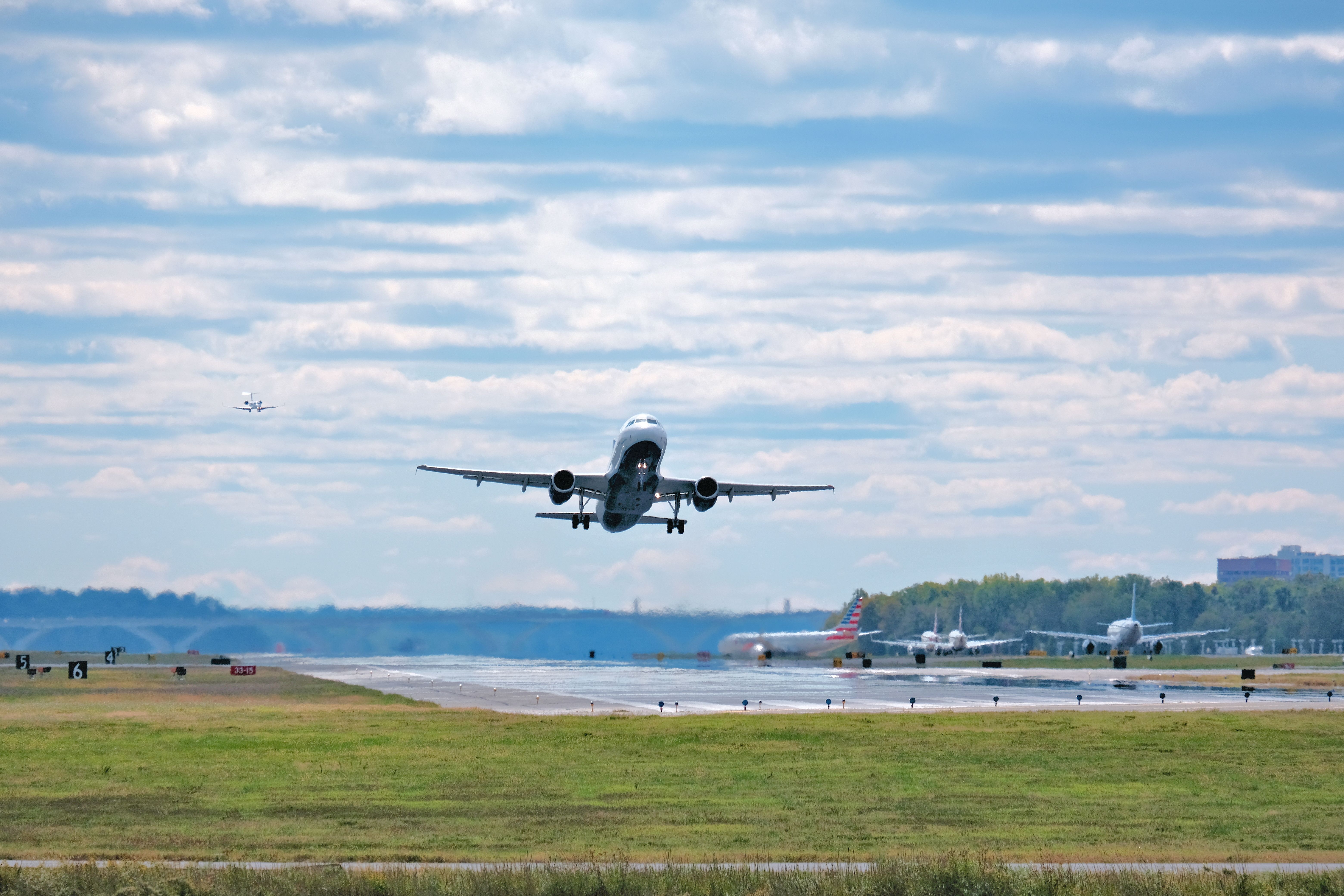 An airplane takes off from Reagan National Airport in Arlington, Virginia as seen from Gravelly Point park.