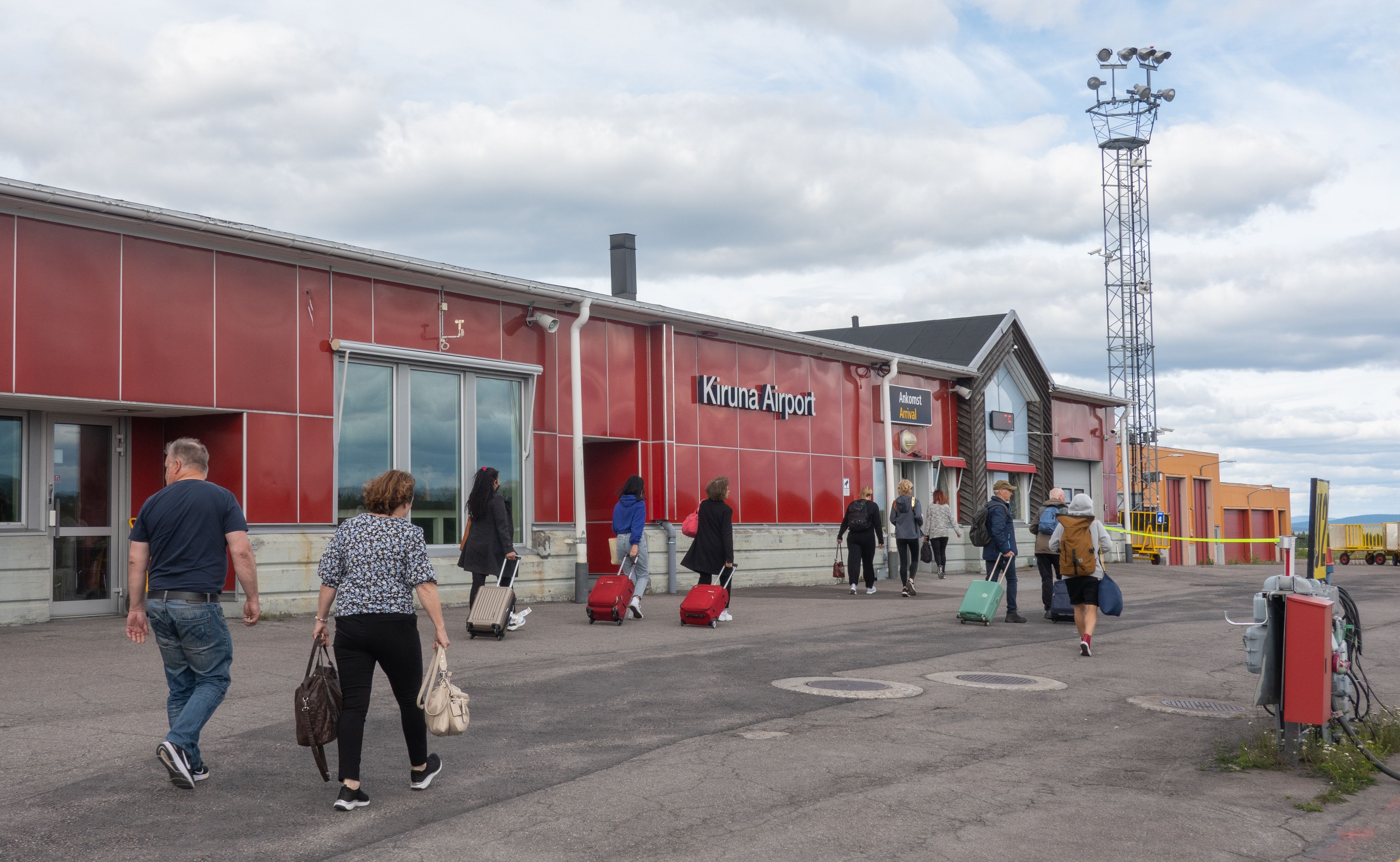 Passengers Walking To The Kiruna Airport Terminal.