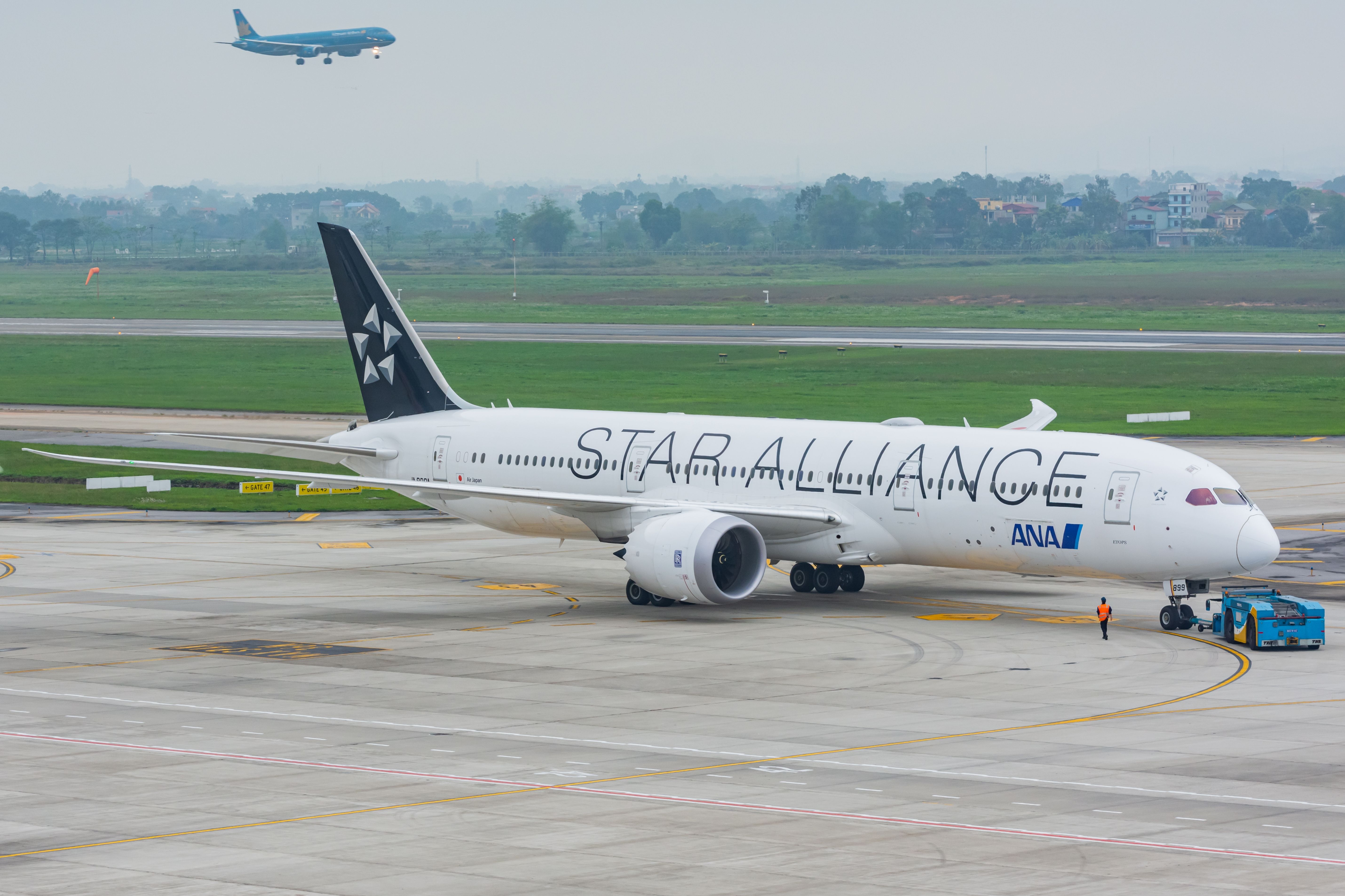 All Nippon Airways ANA in Star Alliance livery being pushed back at Noi Bai International Airport (HAN).