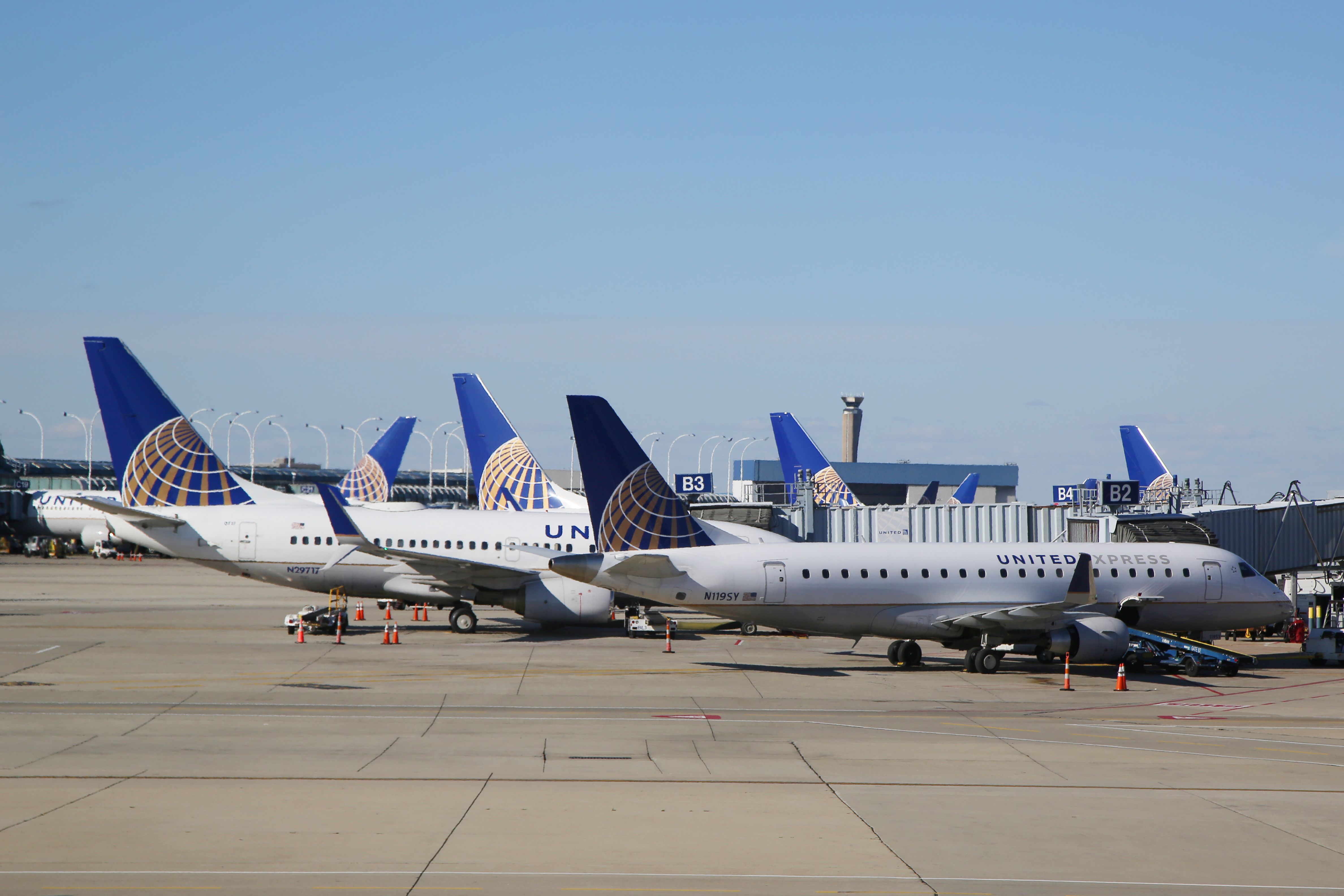 Multiple United Airlines Aircraft parked on an airport apron.