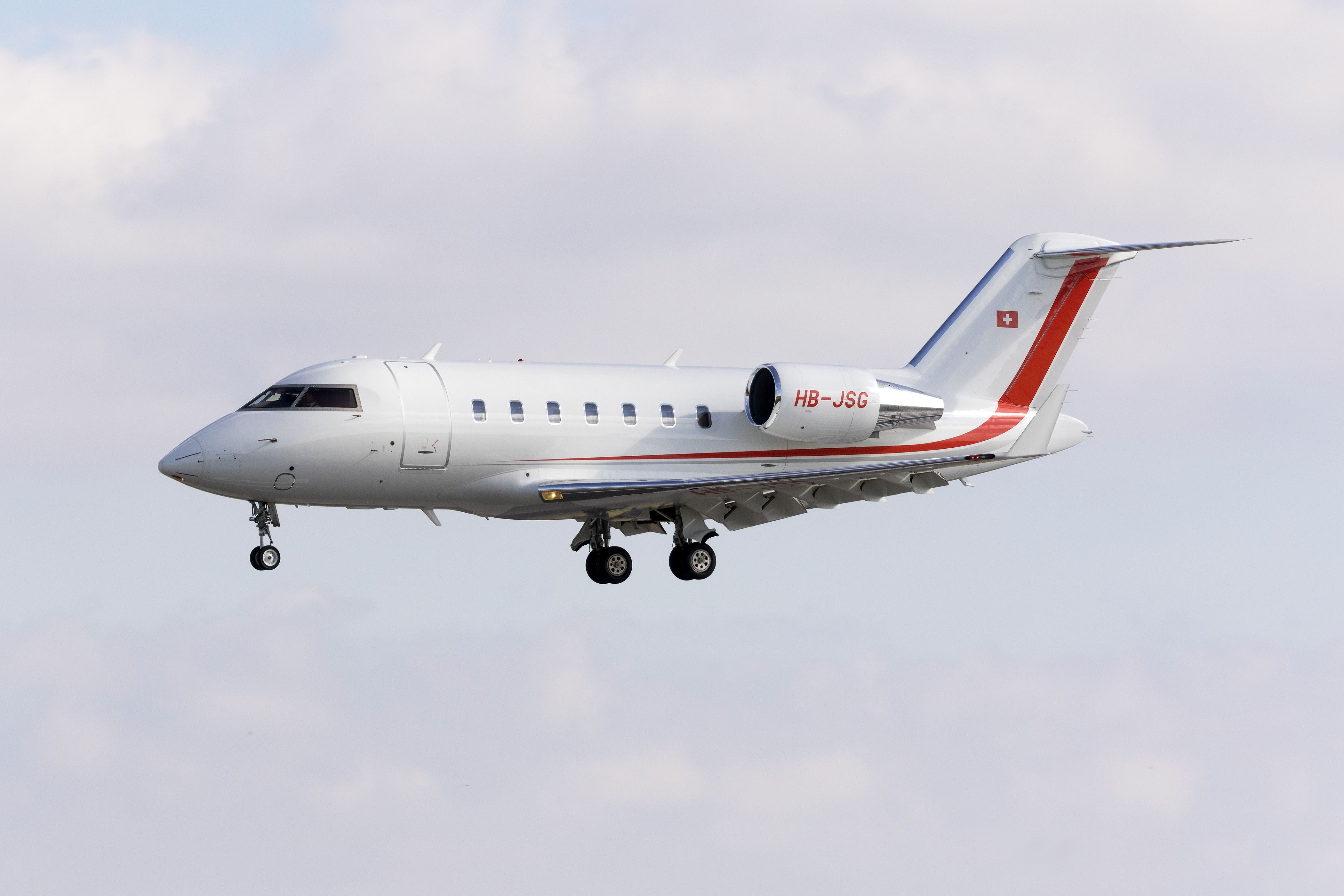 A Bombardier Challenger 605 flying in the sky.