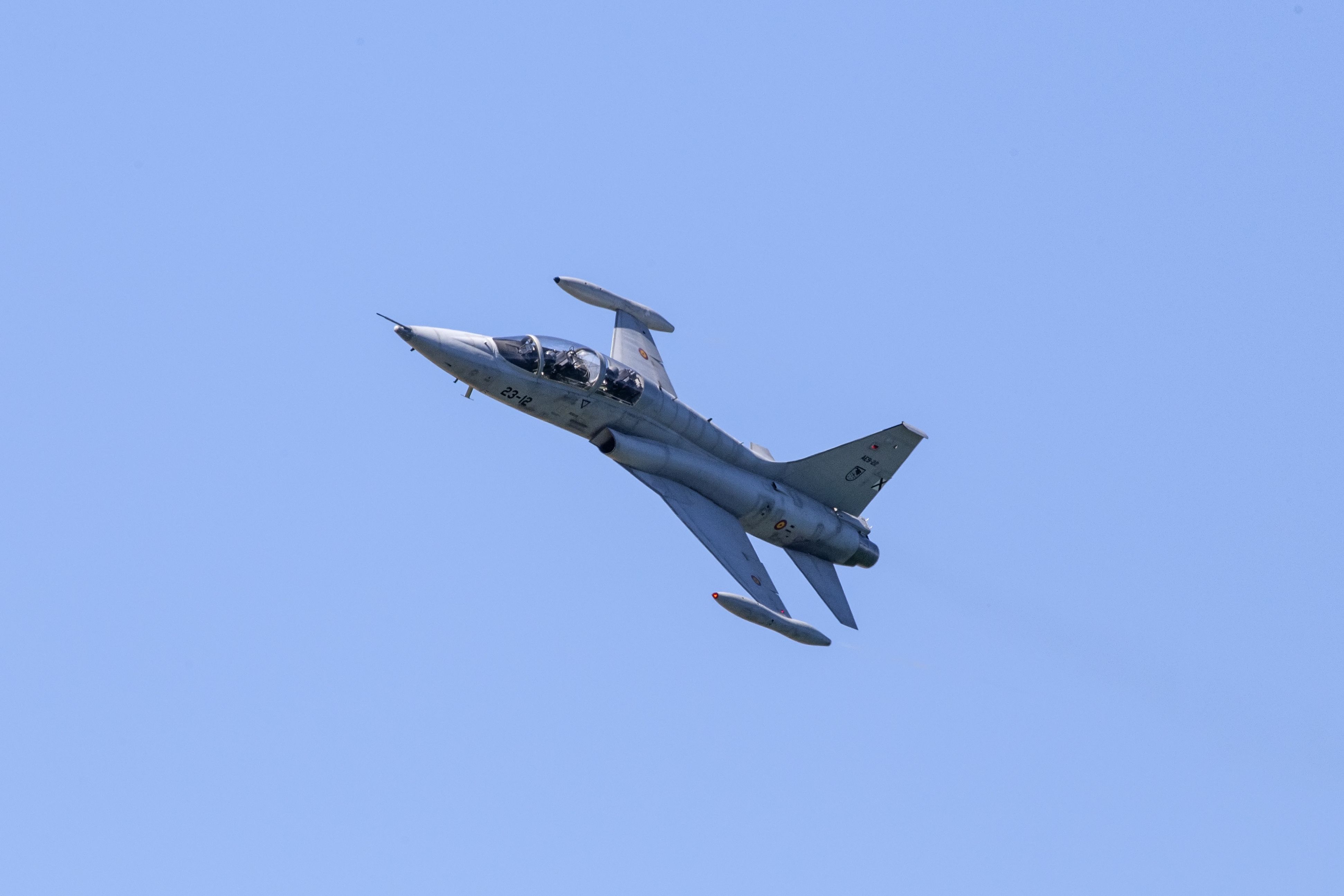 A Northrop F-5 flying in the sky.