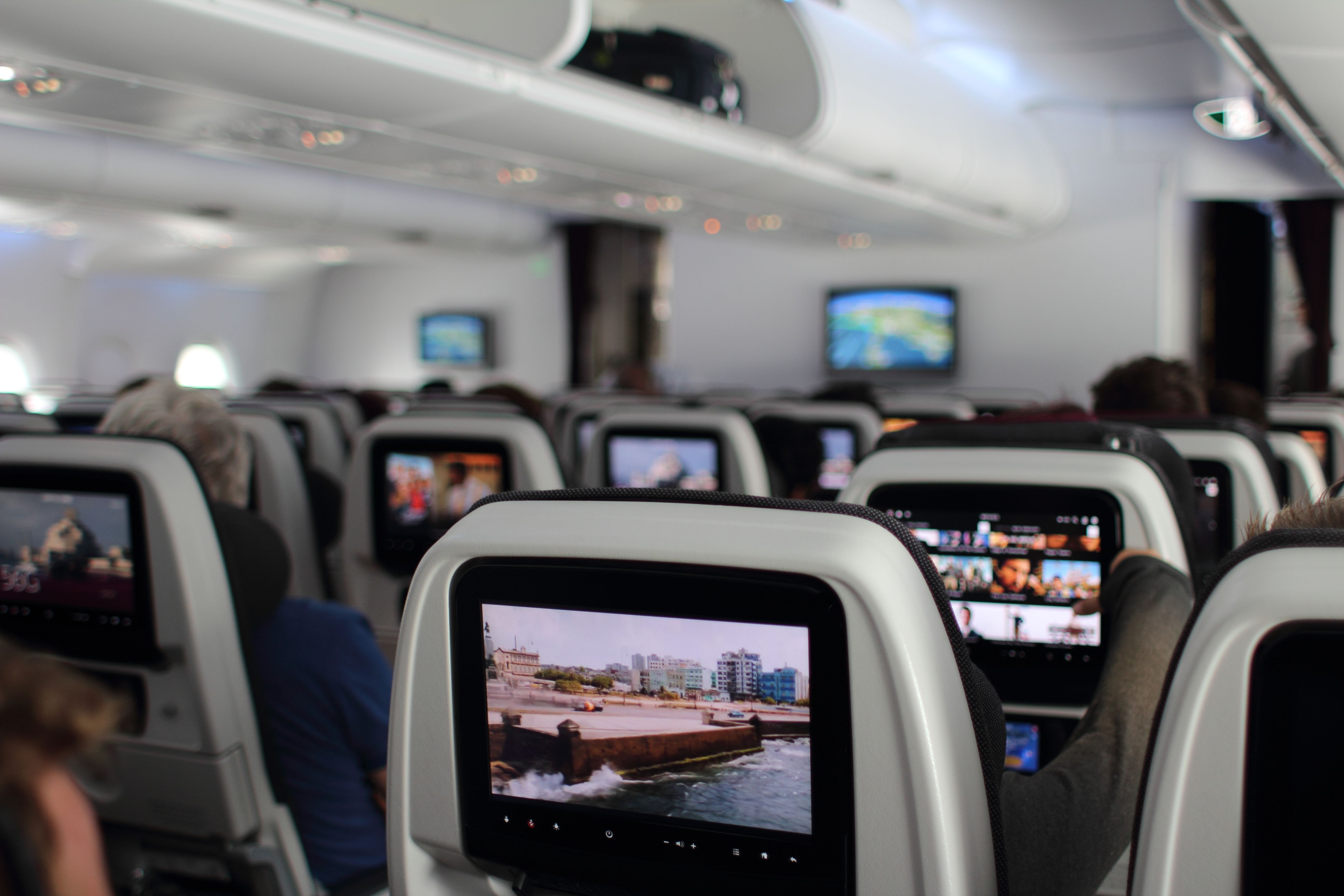 A panoramic view of the Qatar Airways Economy Class cabin.