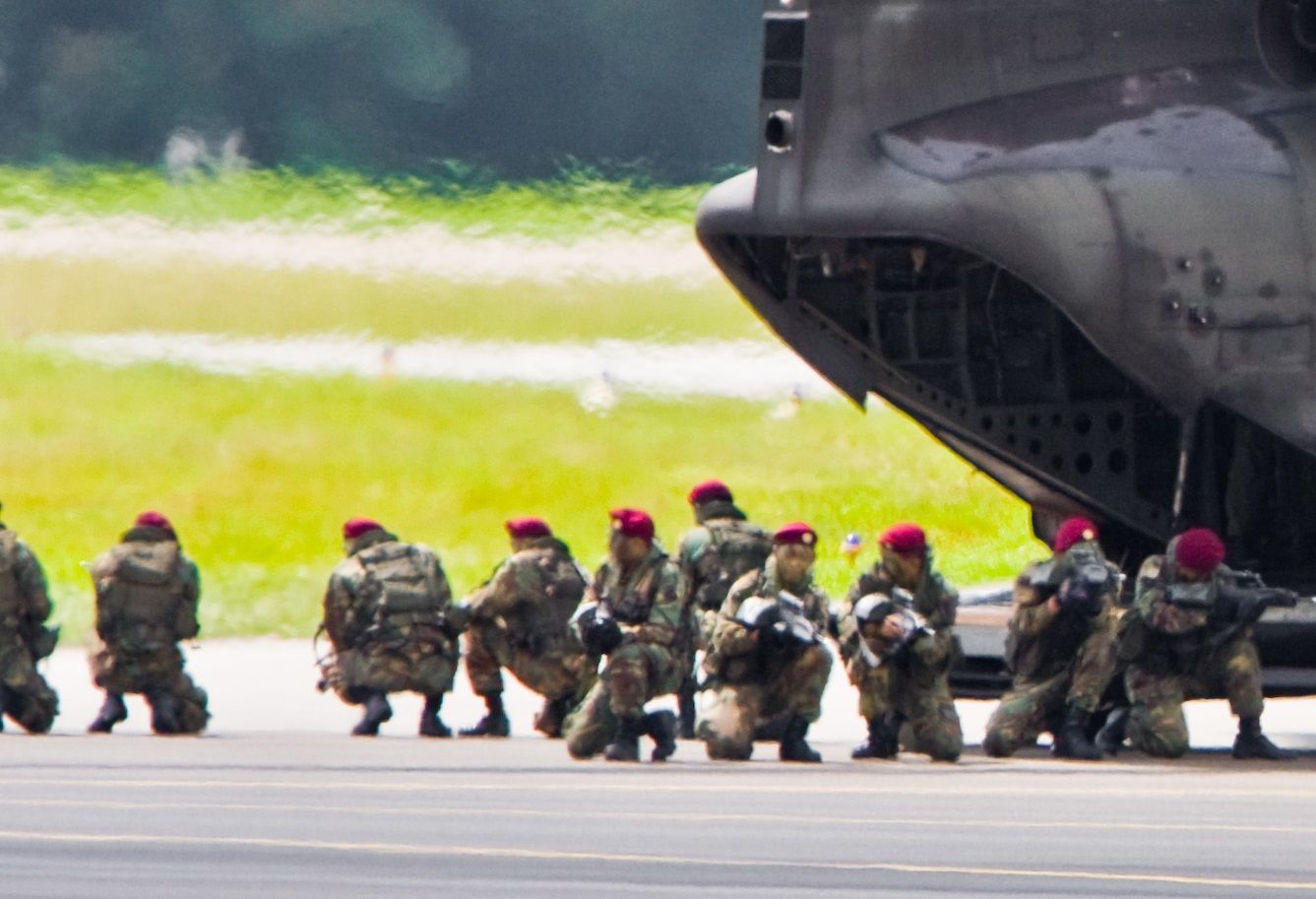 Several members of the Singapore special forces on an airfield.