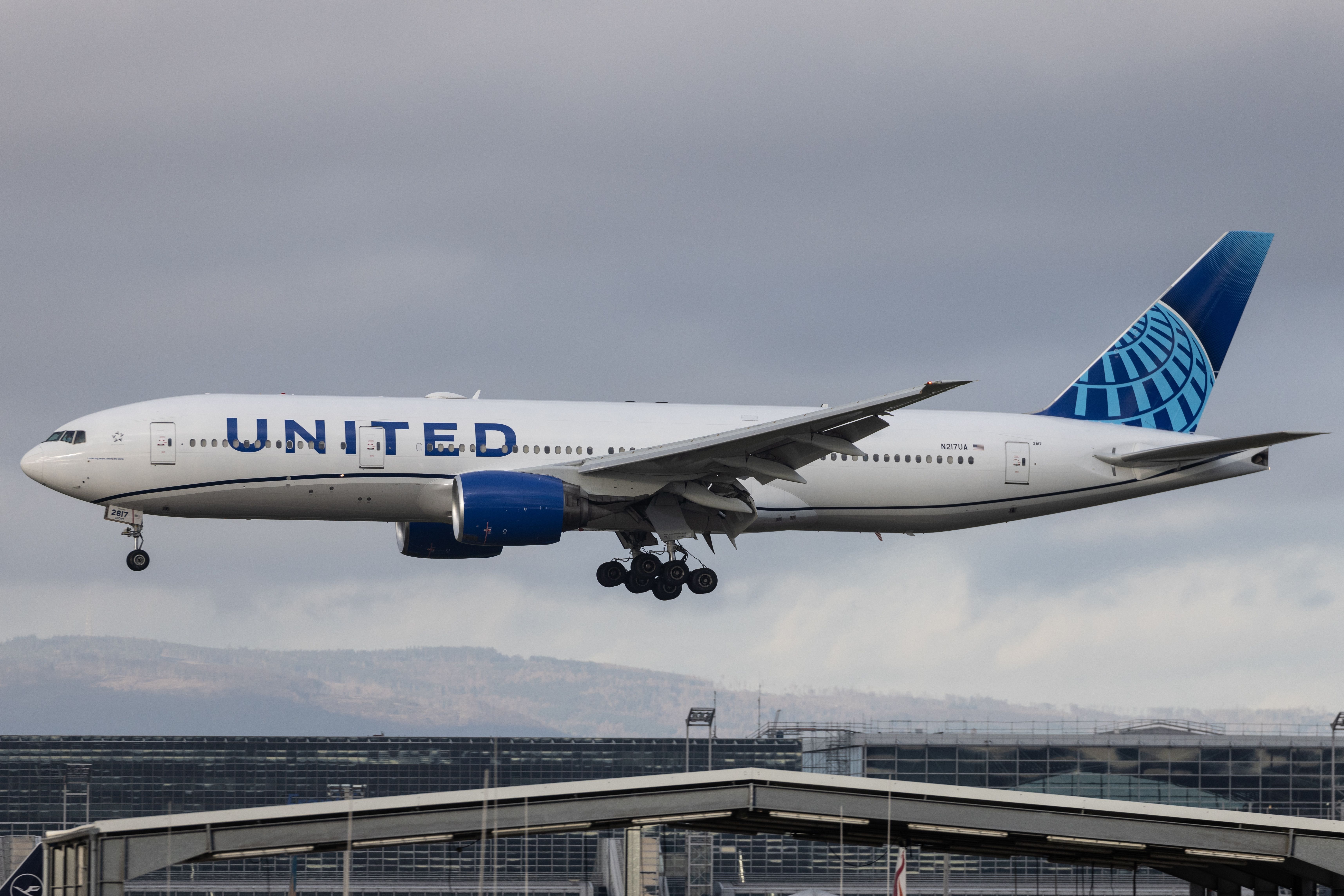 United Airlines Boeing 777 landing at Franfkurt Airport FRA shutterstock_2340546693