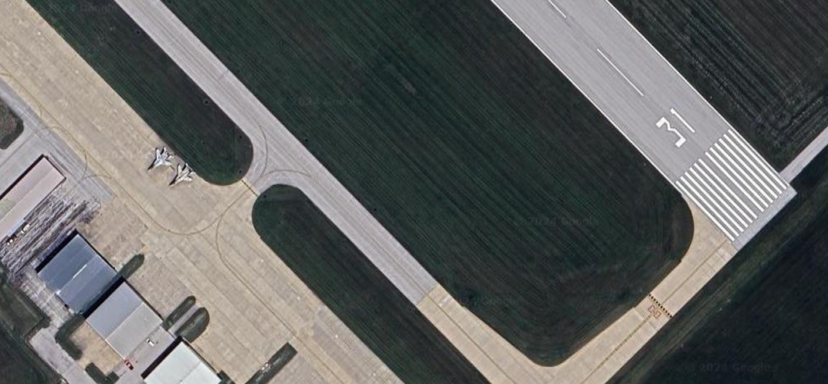 An aerial view of Two Mig 29s parked at Quincy Airport.