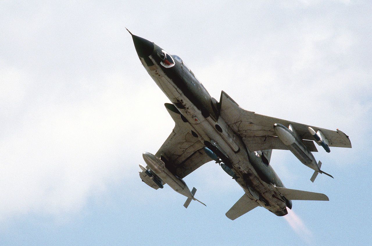 An F-105 Thunderchief flying in the sky.
