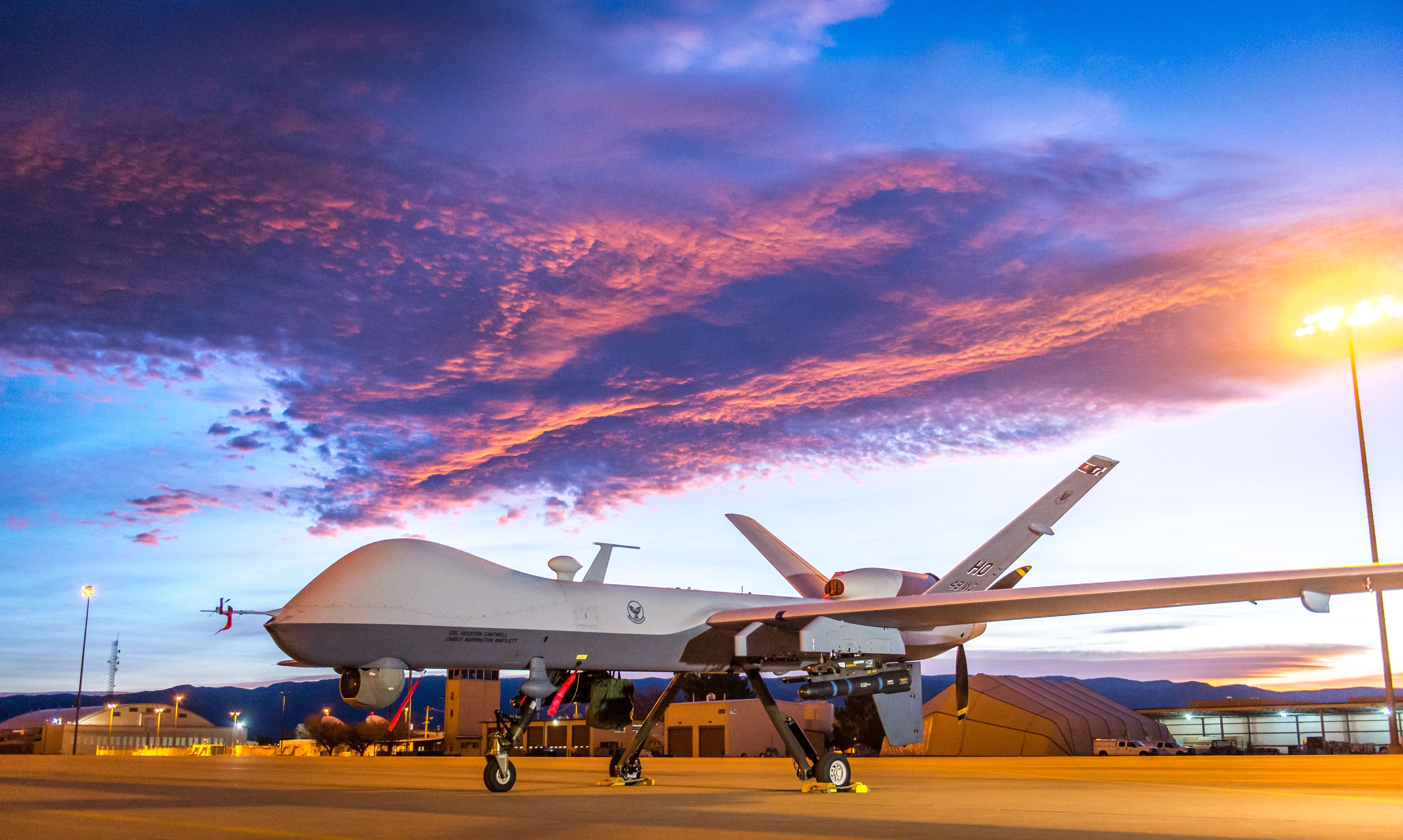 The sun rises over an MQ-9 Reaper remotely piloted aircraft at Holloman Air Force Base, N.M., Dec. 16, 2016. The 49th Aircraft Maintenance Squadron supports the 6th Reconnaissance Squadron 
