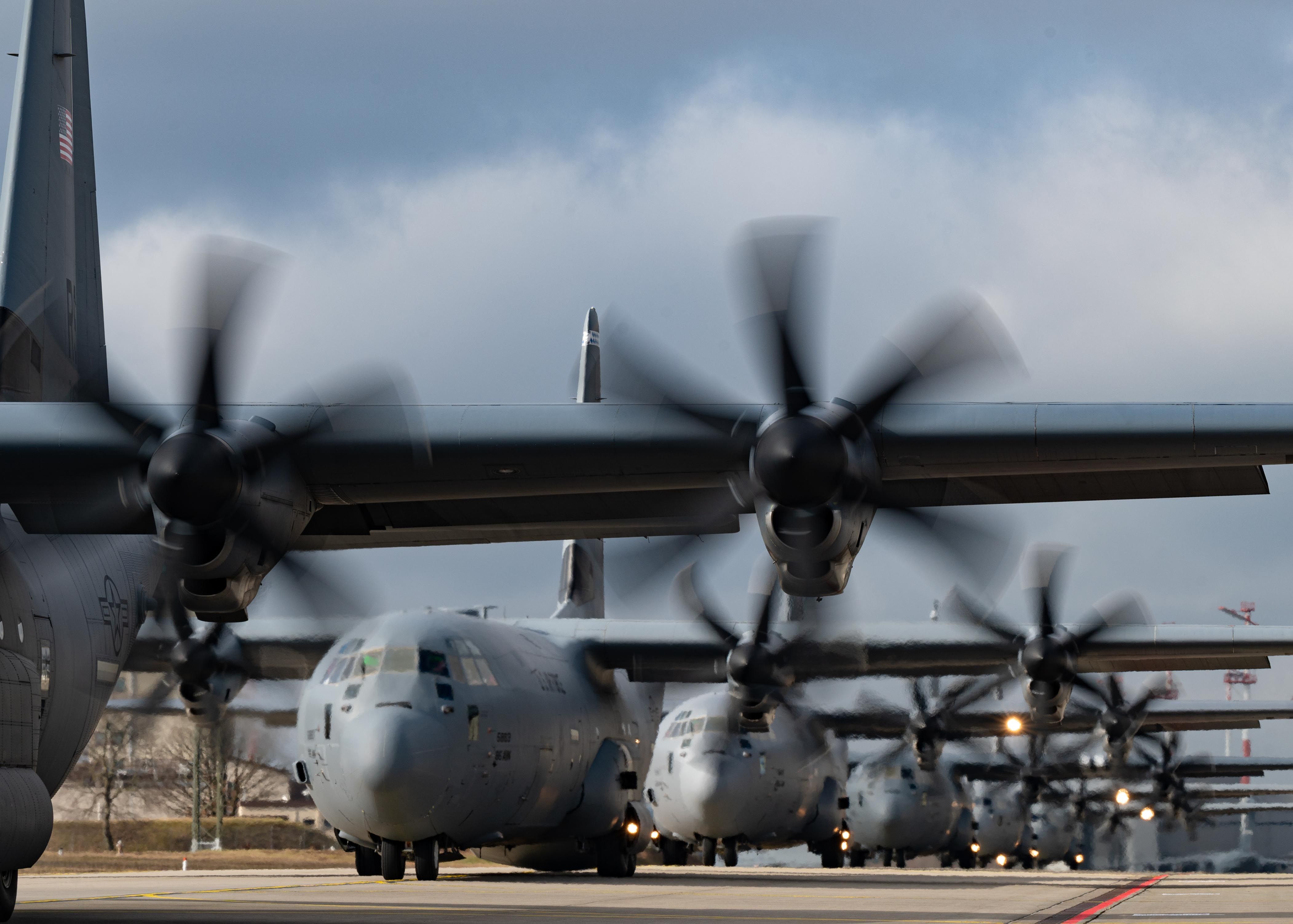 Six U.S. Air Force C-130J Super Hercules from the 86th Airlift Wing taxi down the flightline at Ramstein Air Base, Germany, Feb. 13, 2024.
