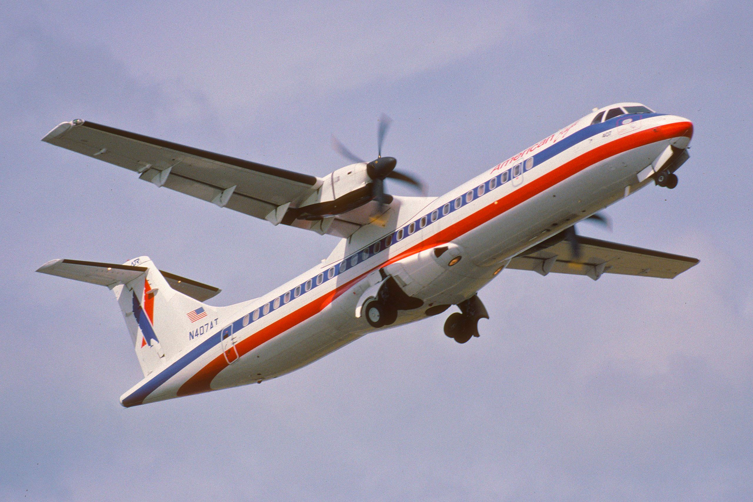 An American Eagle ATR 72-212 flying in the sky.
