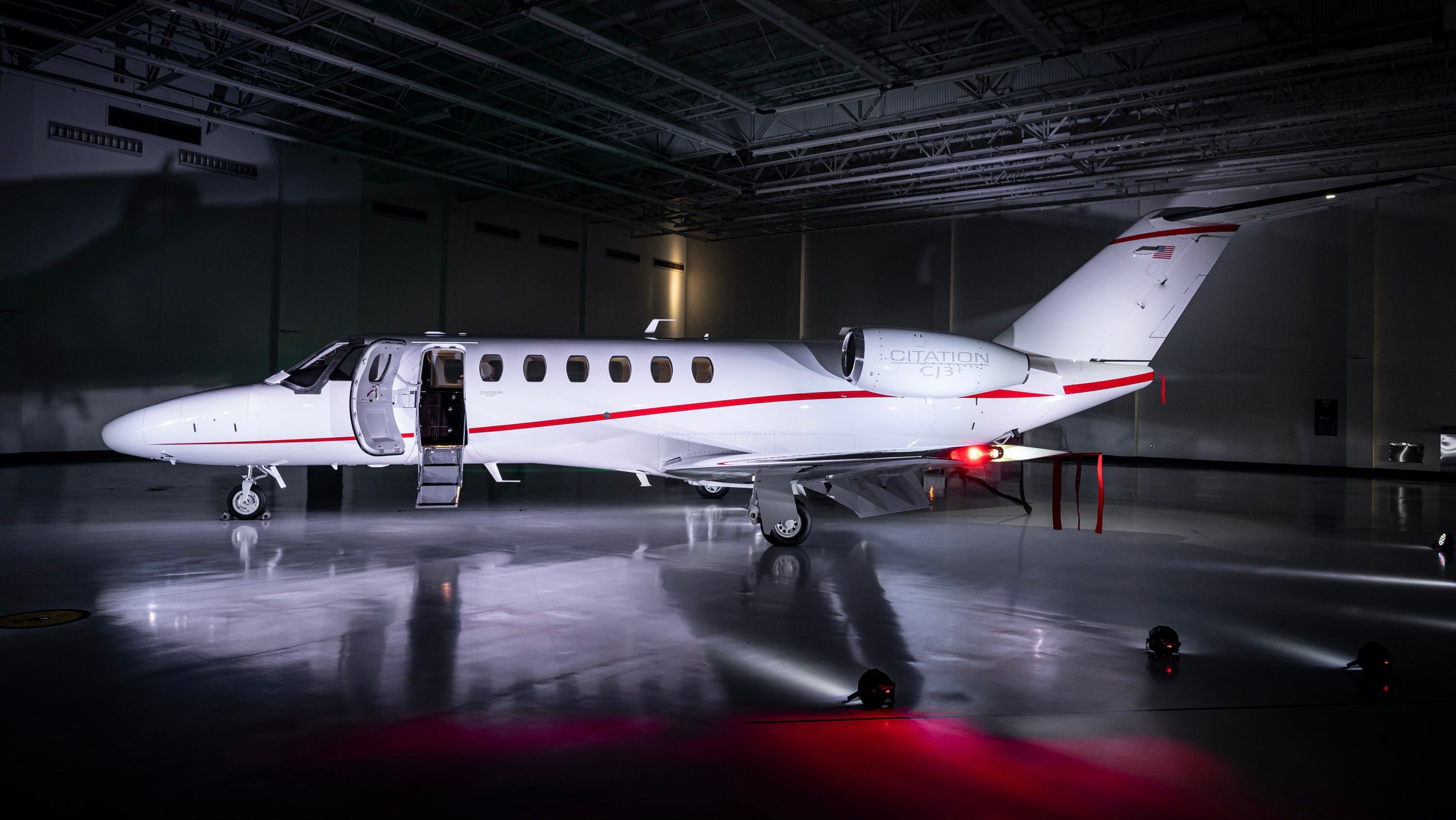 A Cessna Citation CJ3+ parked in a hangar.