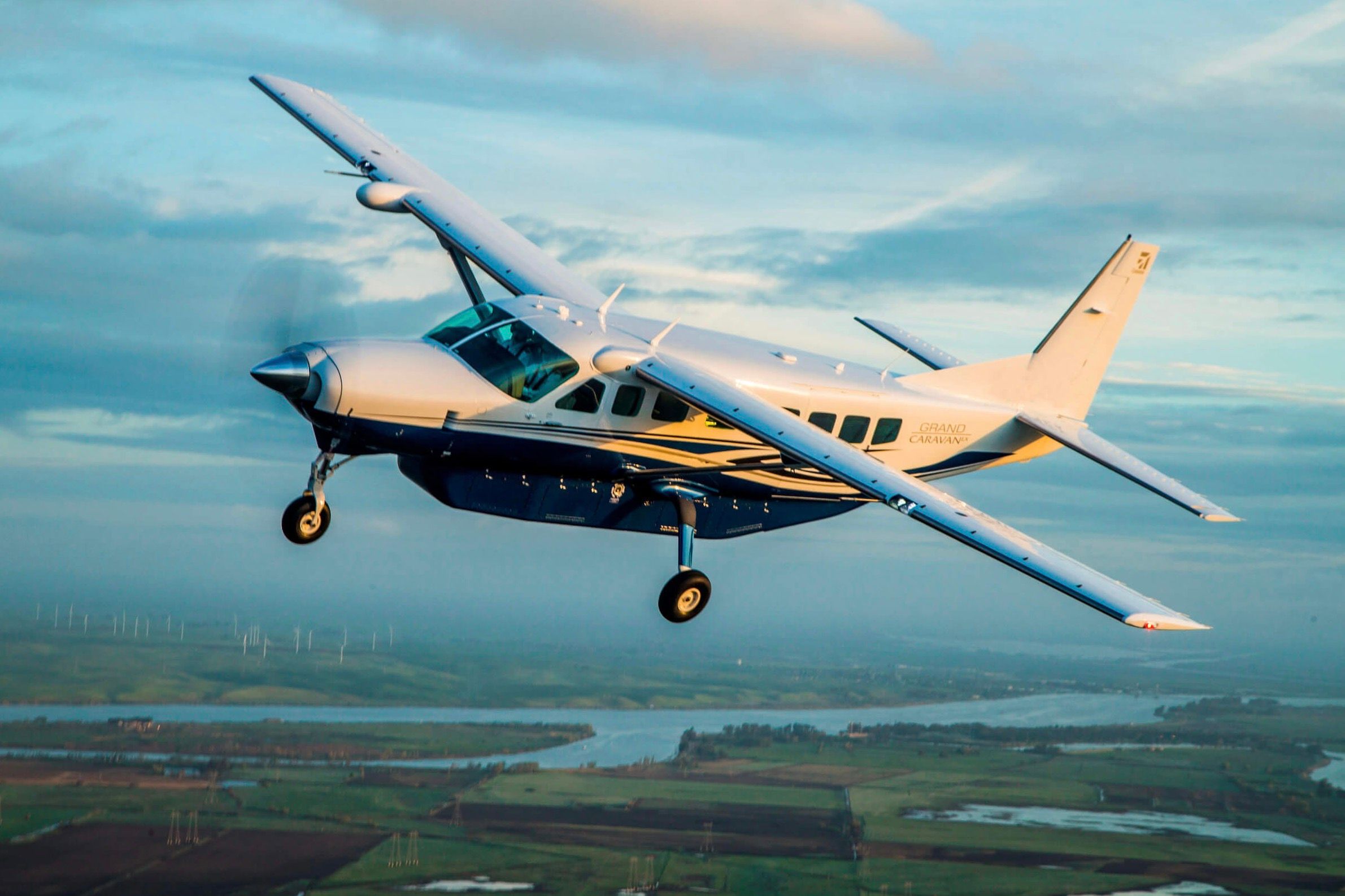 A Cessna Grand Caravan EX flying in the sky.