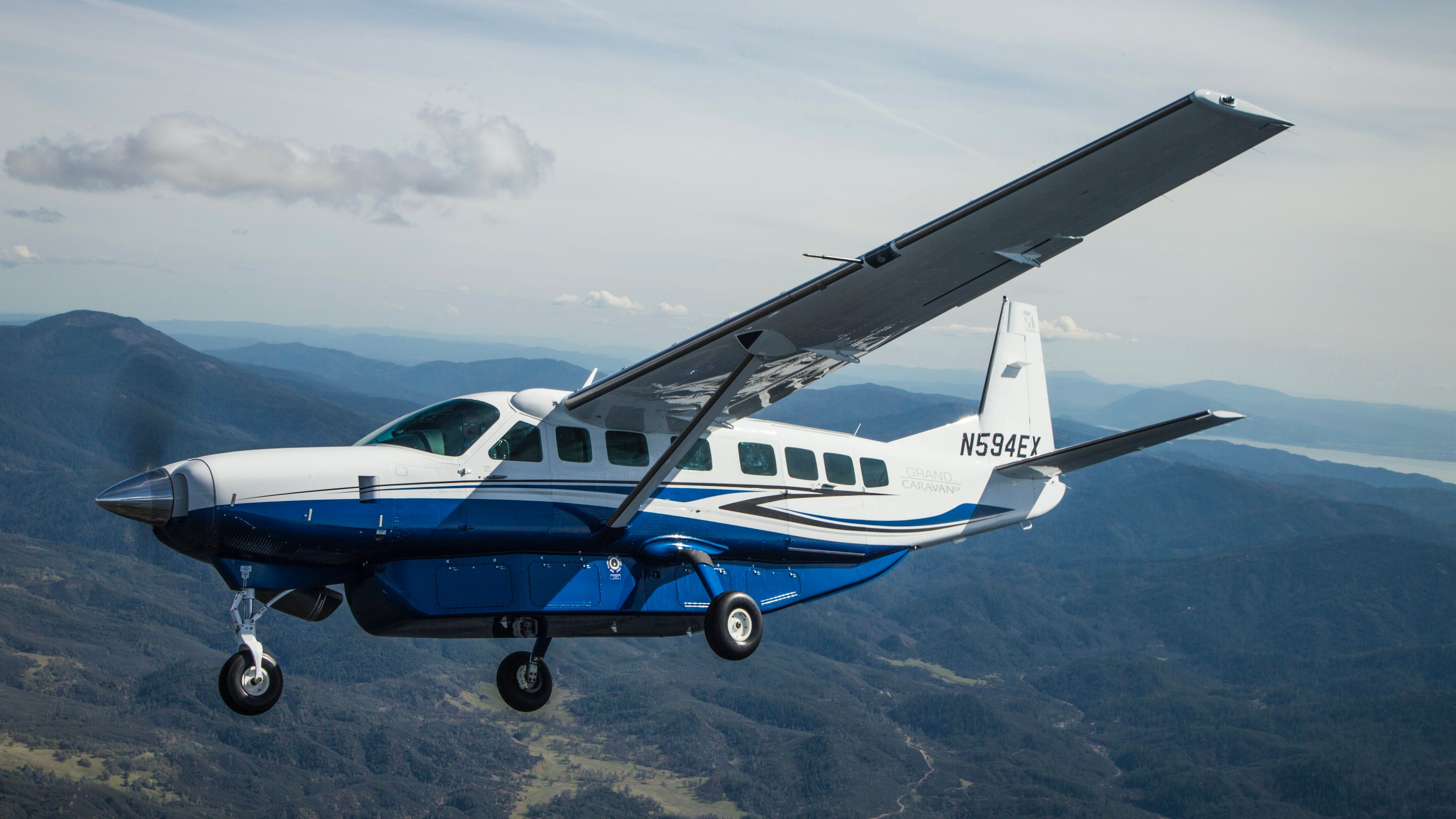 A Cessna Grand Caravan EX flying in the sky.