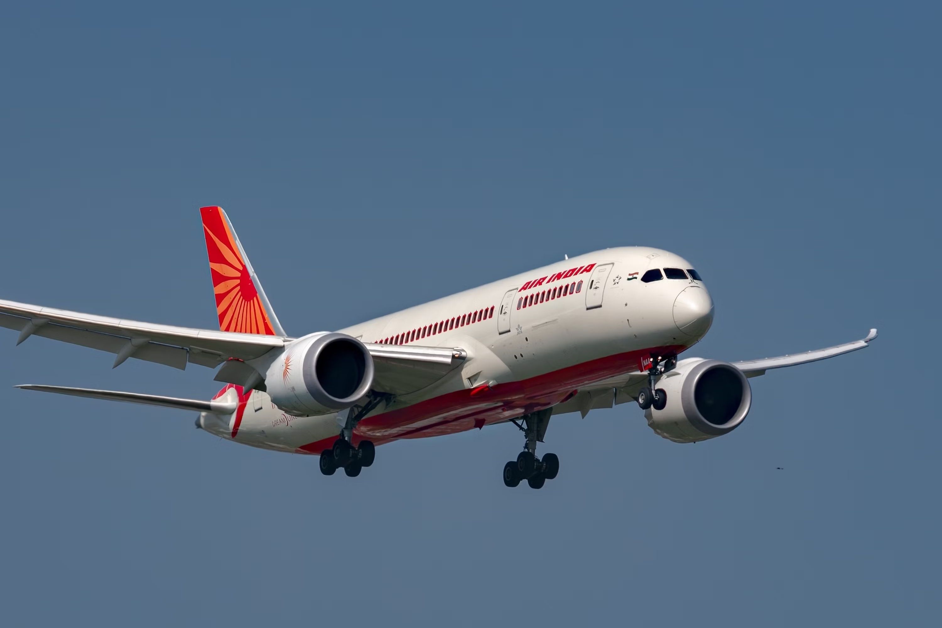 An Air India Boeing 787 flying in the sky.